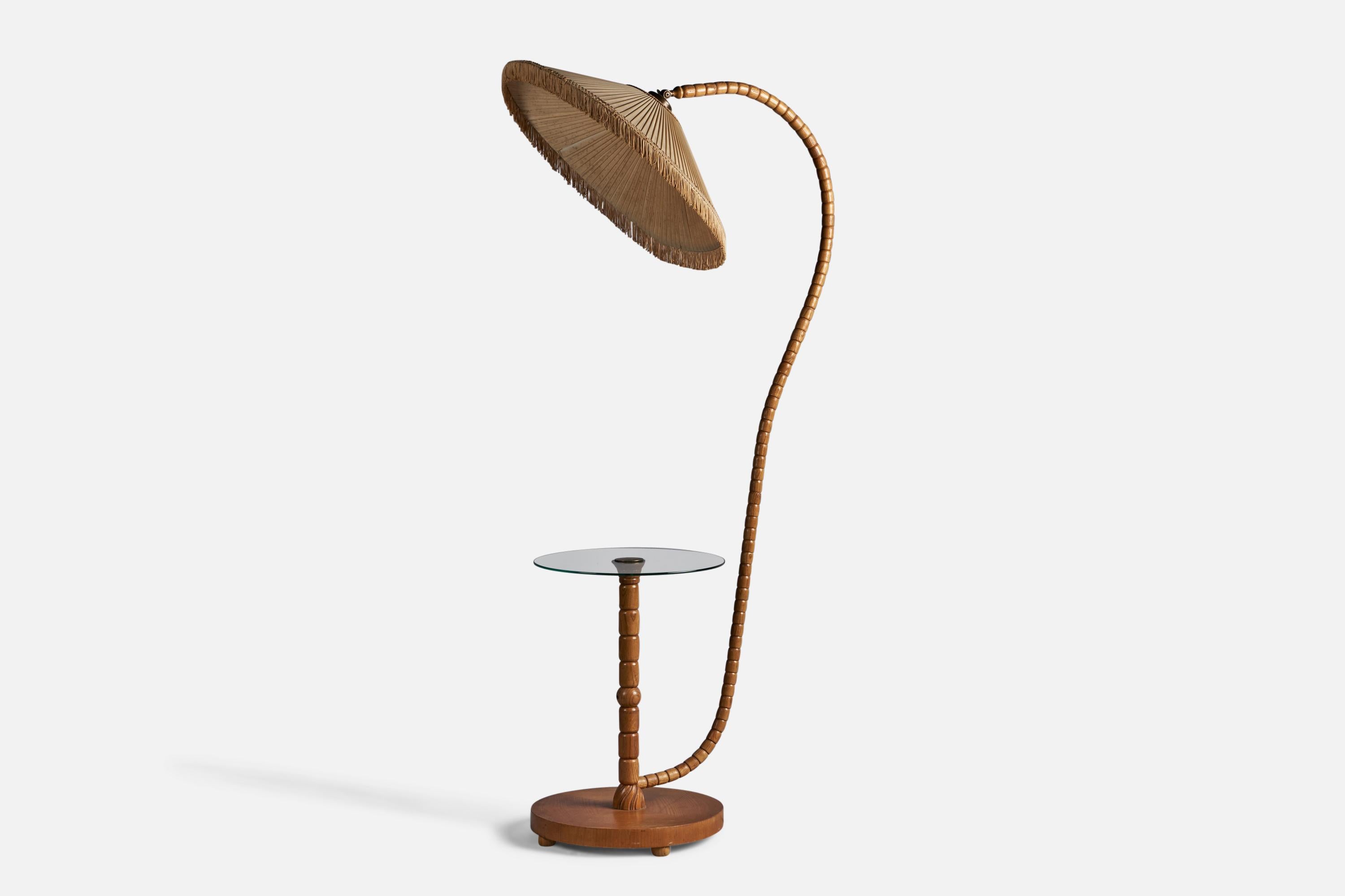 A pine, fabric, brass and glass floor lamp with side table or lamp table, designed and produced in Sweden, c. 1930s.

Overall Dimensions (inches): 63.5