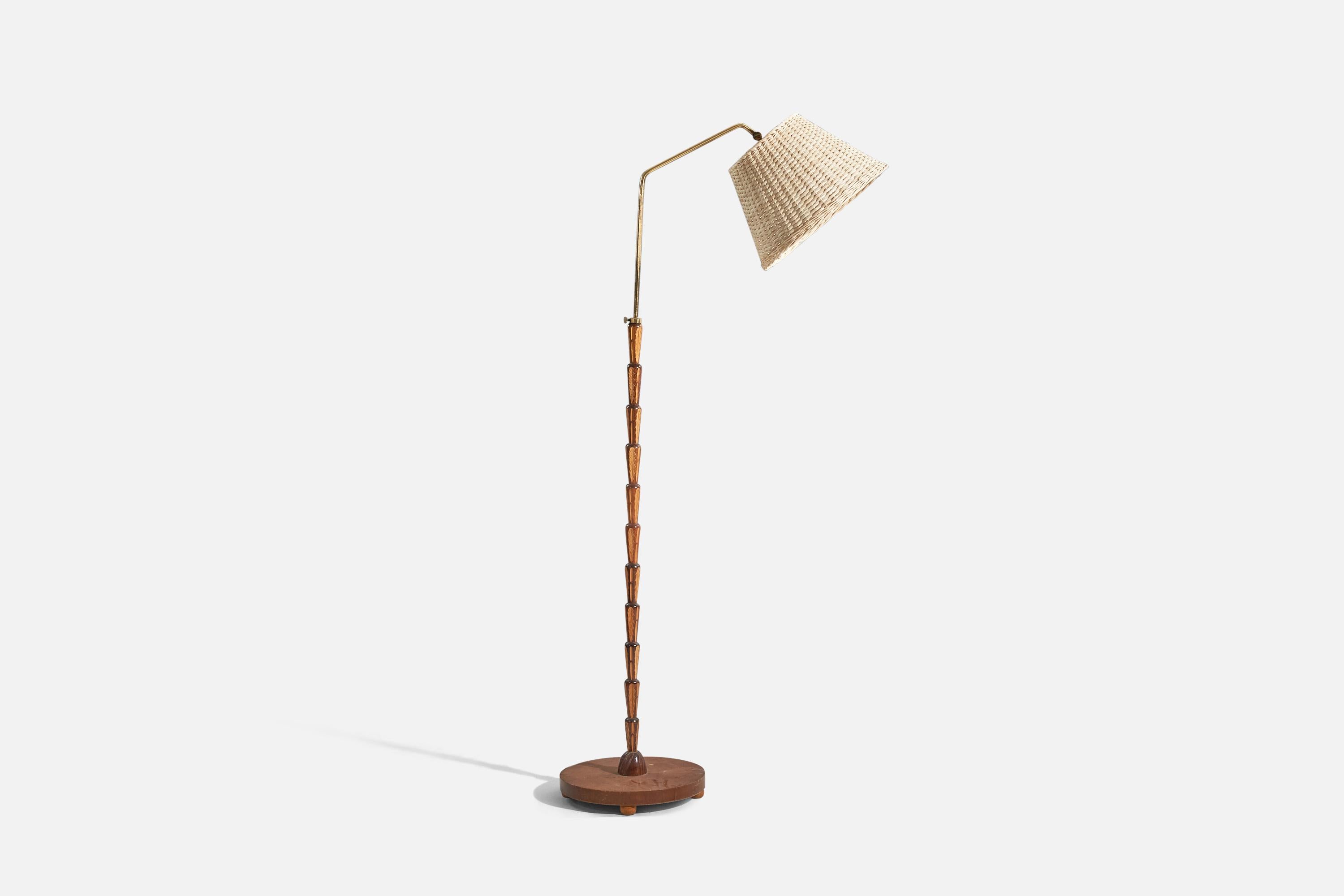 A brass, inlaid wood and rattan floor lamp designed and produced by a Swedish designer, Sweden, 1930s. 

Sold with lampshade. 
Stated dimensions refer to the floor lamp with lampshades.
 