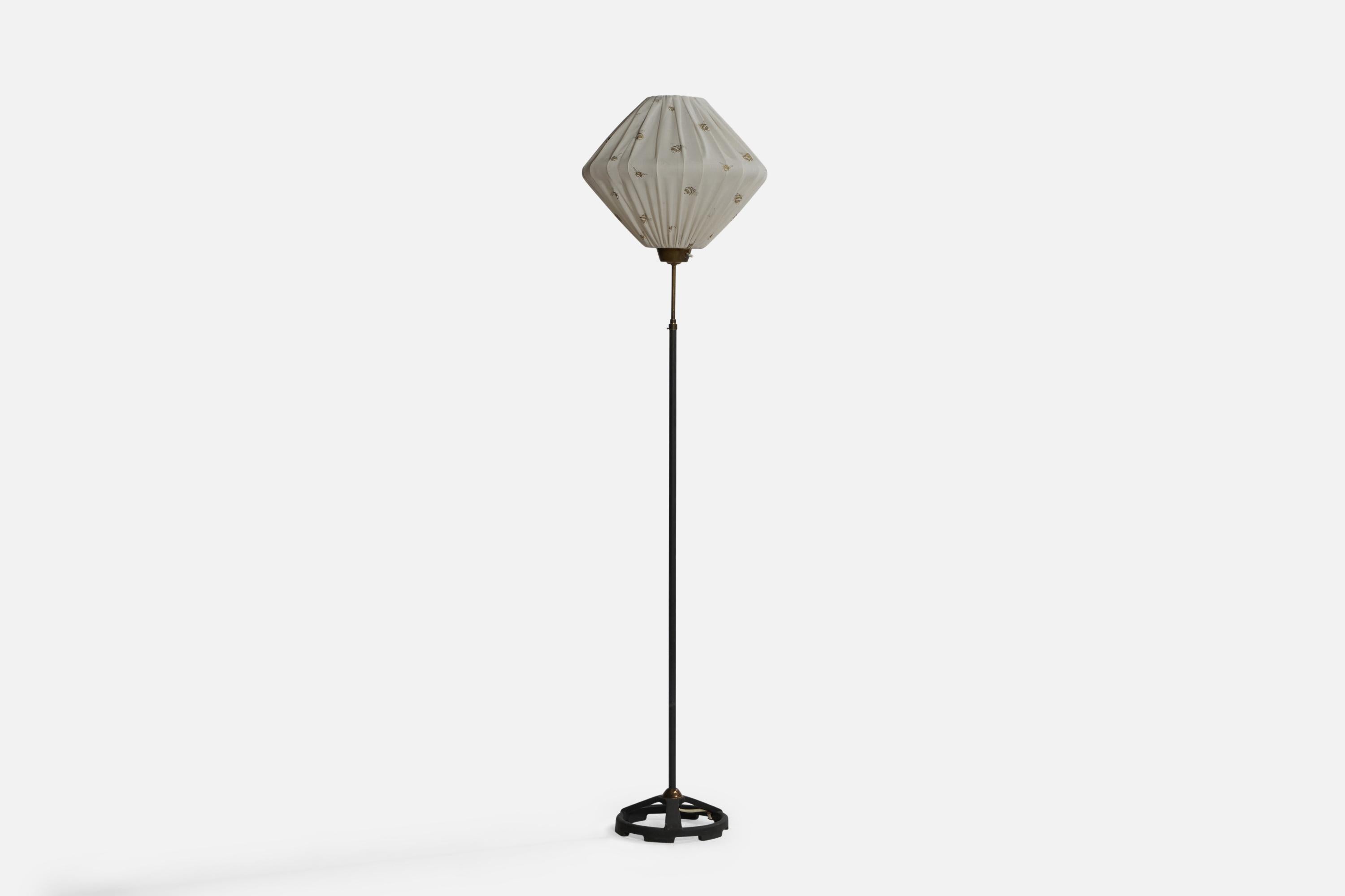 A brass, black-painted iron and printed off-white fabric floor lamp designed and produced in Sweden, c. 1950s.

Overall Dimensions (inches): 61” x 15.5” Diameter. Stated dimensions include shade.
Bulb Specifications: E-26 Bulb
Number of Sockets: