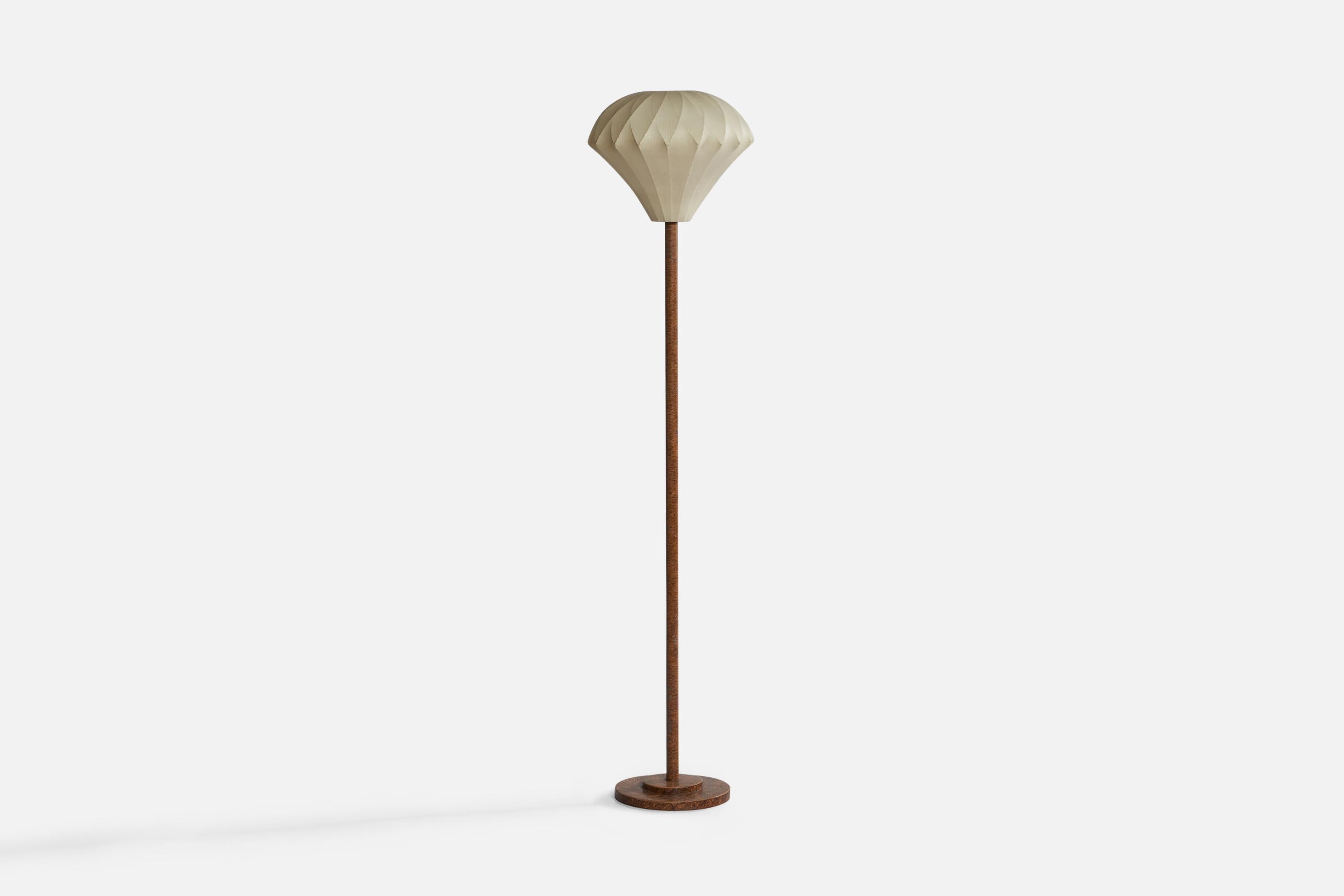 A trompe l'oeil style hand-painted cast iron and waxed fabric floor lamp designed and produced in Sweden, 1930s.

Overall Dimensions (inches): 58.25” H x 12.5” Diameter. Stated dimensions include shade.
Bulb Specifications: E-26 Bulb
Number of