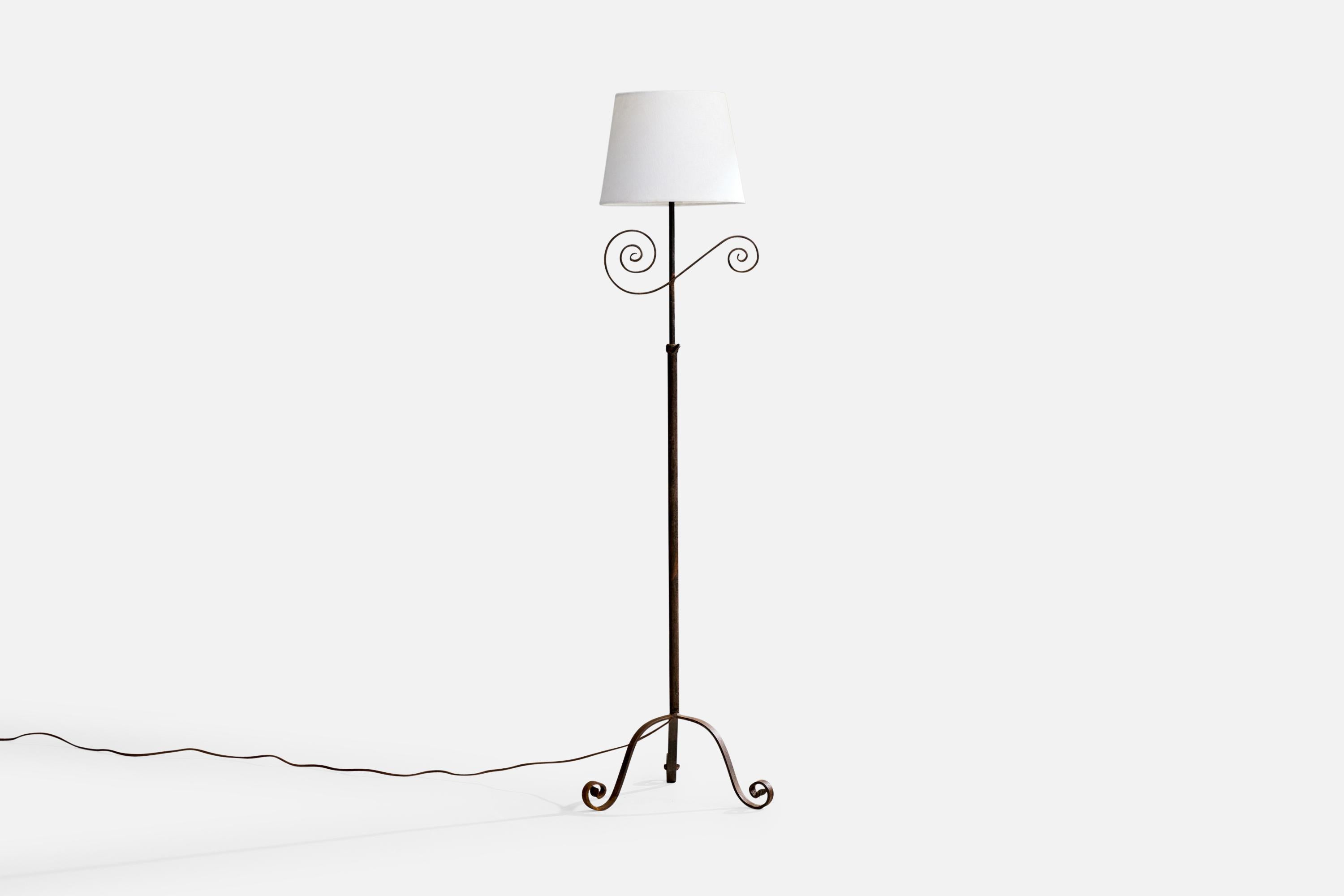 A black-painted iron and white fabric floor lamp designed and produced in Sweden, c. 1940s.

Dimensions of Lamp with Shade (inches): 59.25