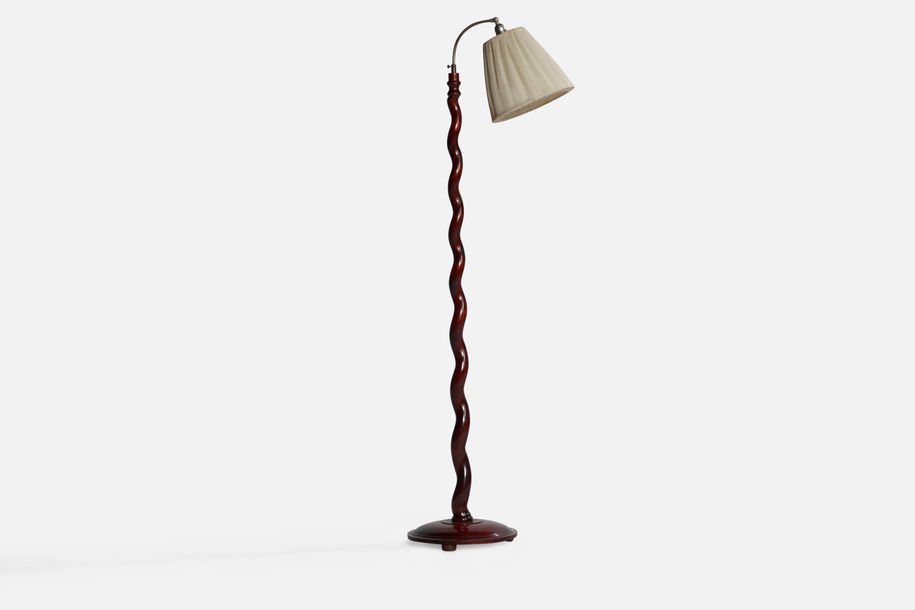 Eine Stehlampe aus Mahagoni, Stahl und cremefarbenem Stoff, entworfen und hergestellt in Schweden, 1930er Jahre.

Gesamtabmessungen (Zoll): 63,5