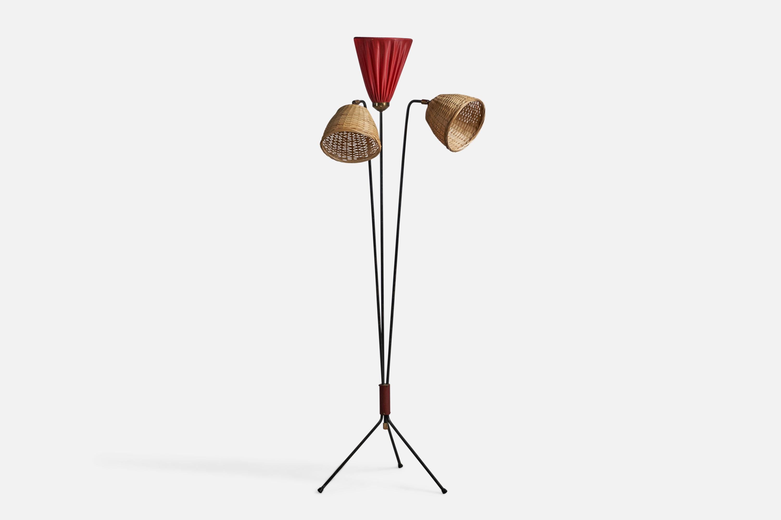 A three-armed brass, black-lacquered metal, red fabric and rattan floor lamp designed and produced in Sweden, 1950s.

Overall Dimensions (inches): 55.8
