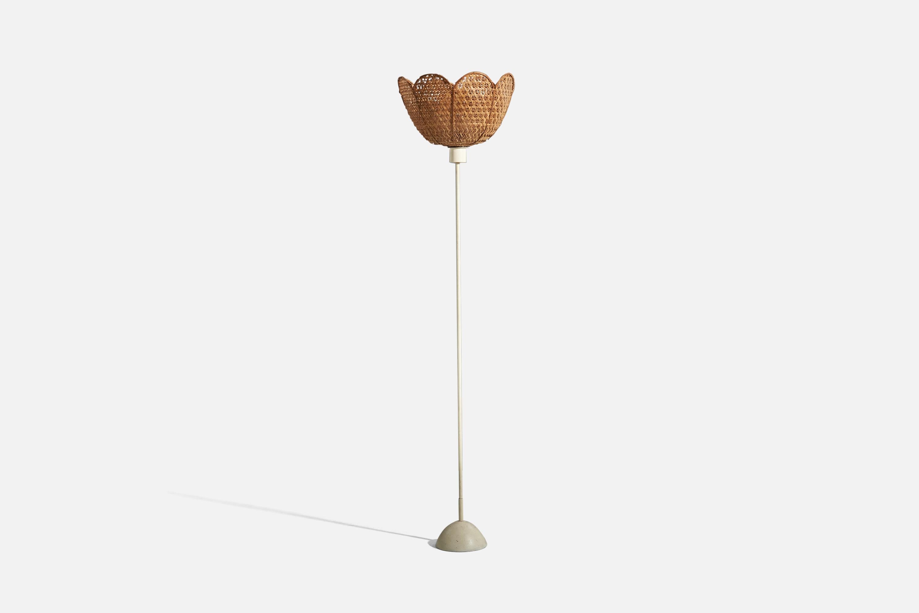 A metal and rattan floor lamp designed and produced in Sweden, 1960s.

Sold with lampshade. 
Dimensions stated refer to the floor lamp with the lampshade.