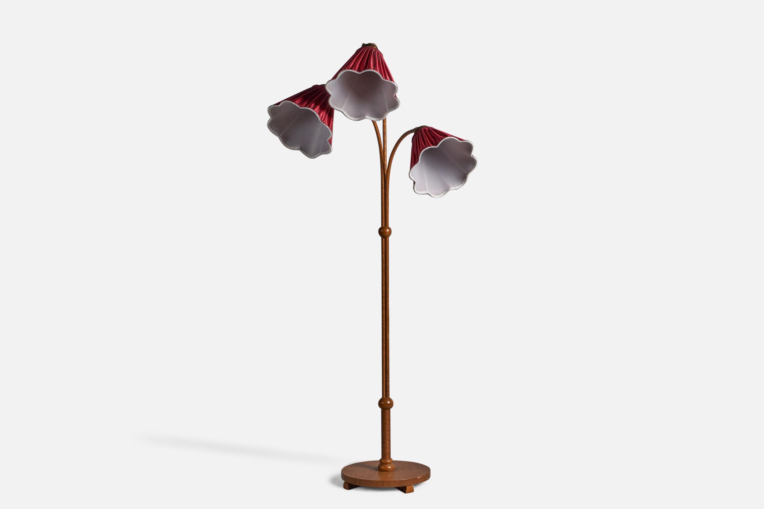 An oak, wrapped wood veneer, brass and red fabric floor lamp, designed and produced in Sweden, c. 1940s.

Overall Dimensions (inches): 63.75