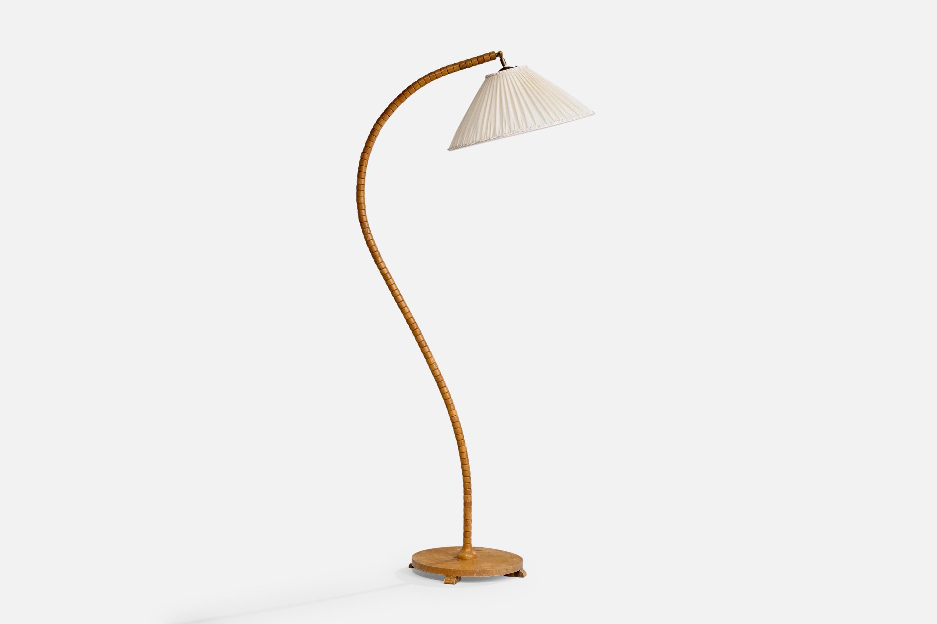 A curved oak and white fabric floor lamp designed and produced in Sweden, c. 1940s.

Dimensions of Lamp with Shade (inches): 64“ H x 18.25“ W x 25.5“ D

Bulb Specifications: E-26 Bulb

Number of Sockets (per fixture): 1

Sold with lampshade.

All