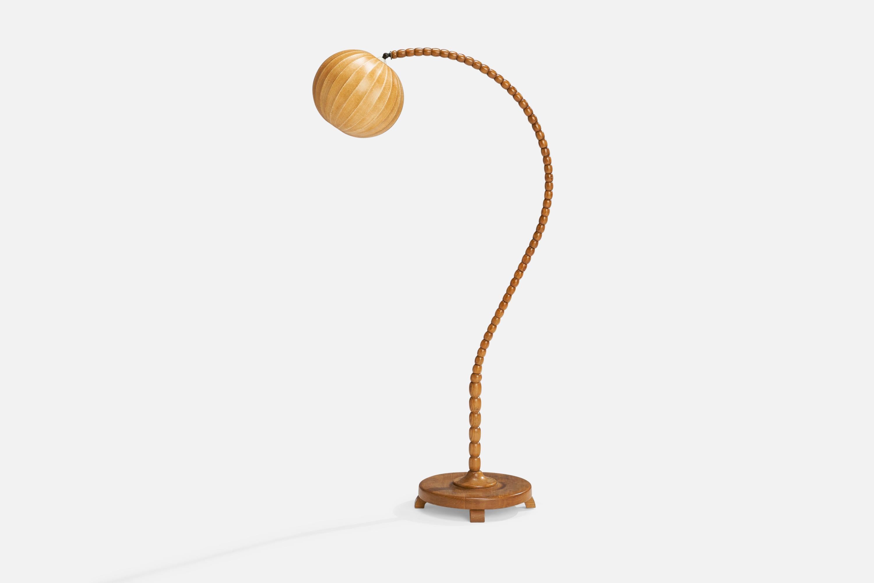 A pine and beige waxed cotton floor lamp designed and produced in Sweden, 1940s.

Overall Dimensions (inches): 59.5” H x 10.5” W x 29” D
Stated dimensions include shade.
Bulb Specifications: E-26 Bulb
Number of Sockets: 1
All lighting will be