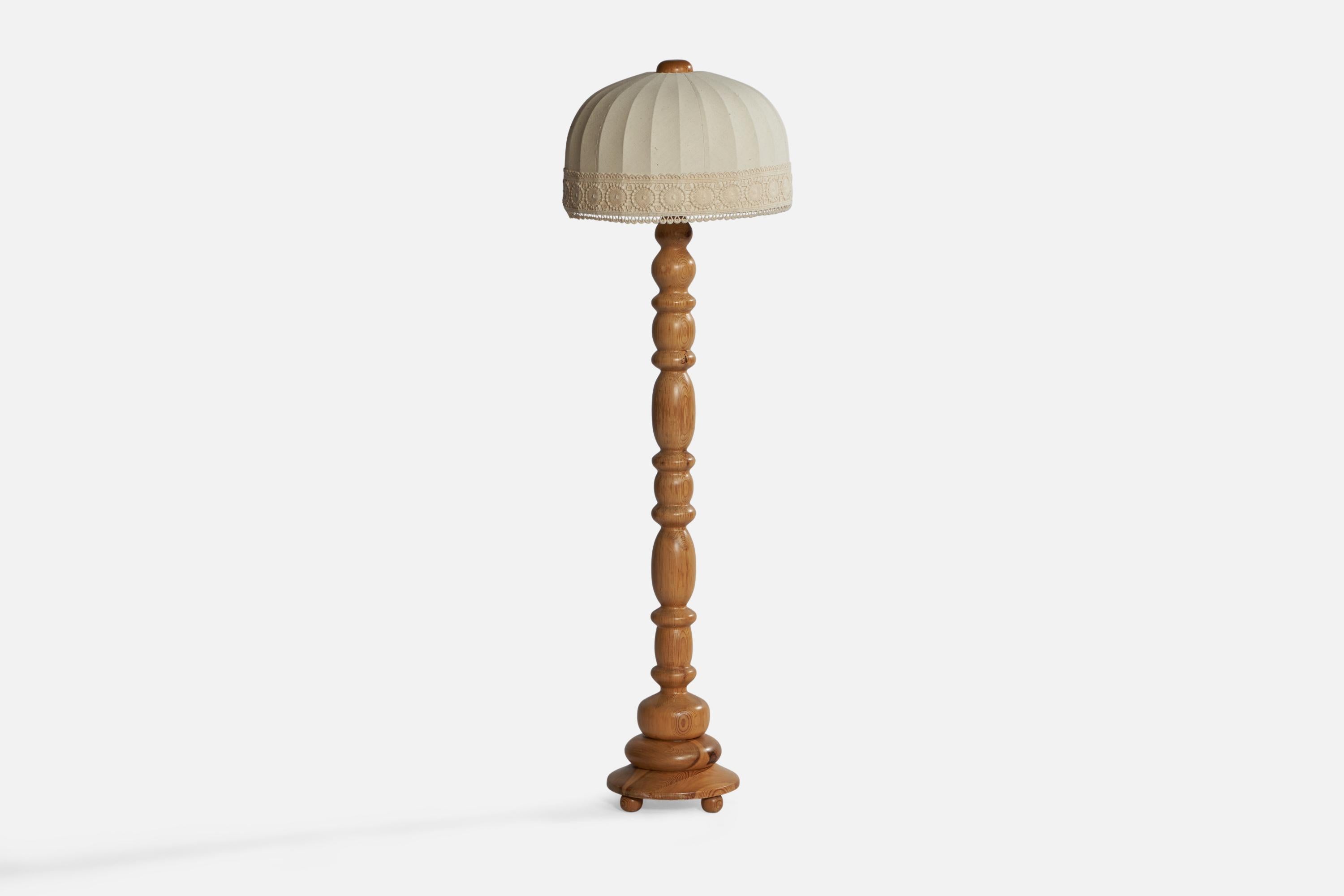 A turned pine and off-white fabric floor lamp designed and produced in Sweden, c. 1970s.

Overall Dimensions (inches): 53” H x 16” Diameter. Stated dimensions include shade.
Bulb Specifications: E-26 Bulb
Number of Sockets: 1
All lighting will be