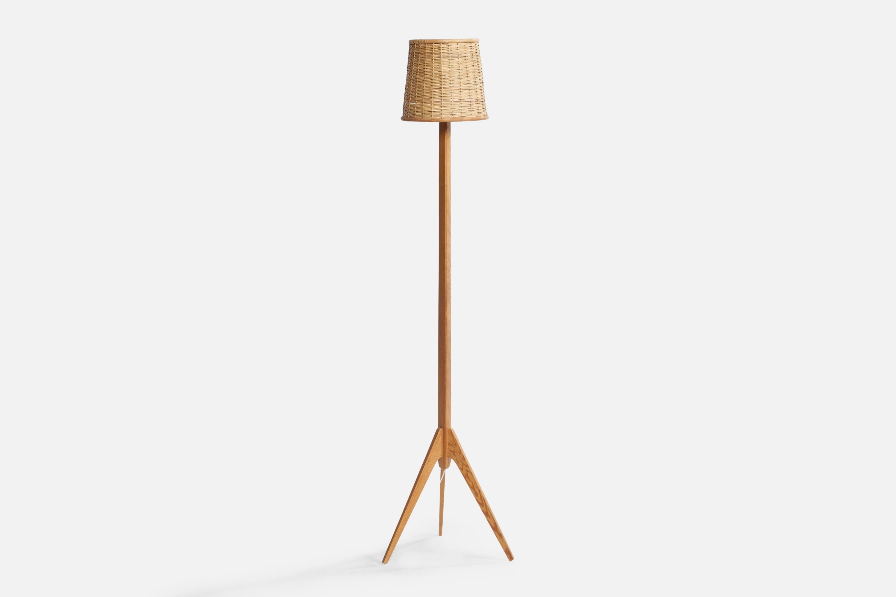 A pine, rattan and bamboo floor lamp designed and produced in Sweden, c. 1960s.

Overall Dimensions (inches): 59” H x 14.75” W x 14.75” D. Stated dimensions include shade.
Bulb Specifications: E-26 Bulb
Number of Sockets: 1
All lighting will be