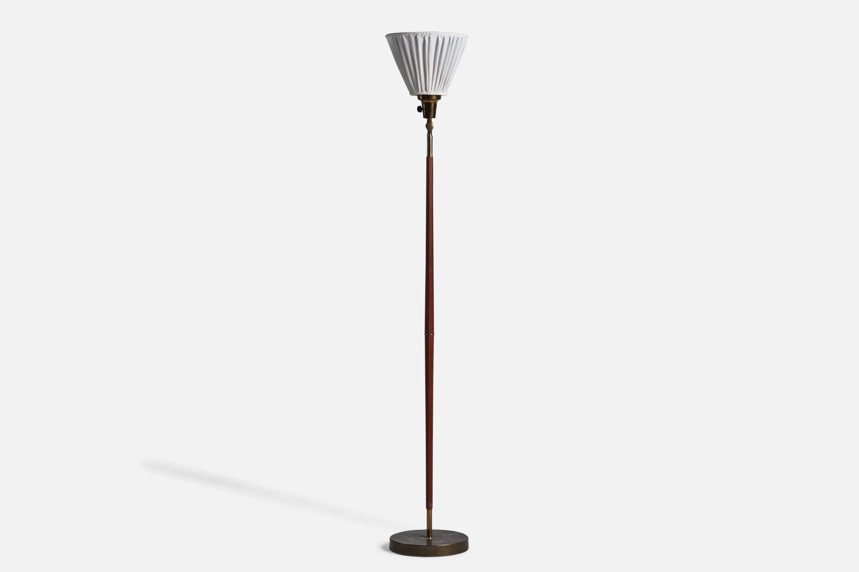 An adjustable teak brass and white fabric floor lamp designed and produced in Sweden, c. 1950s.

Overall Dimensions (inches): 52.5” H x 9.25” W x 16” D
Bulb Specifications: E-26 Bulb
Number of Sockets: 1
All lighting will be converted for US usage.