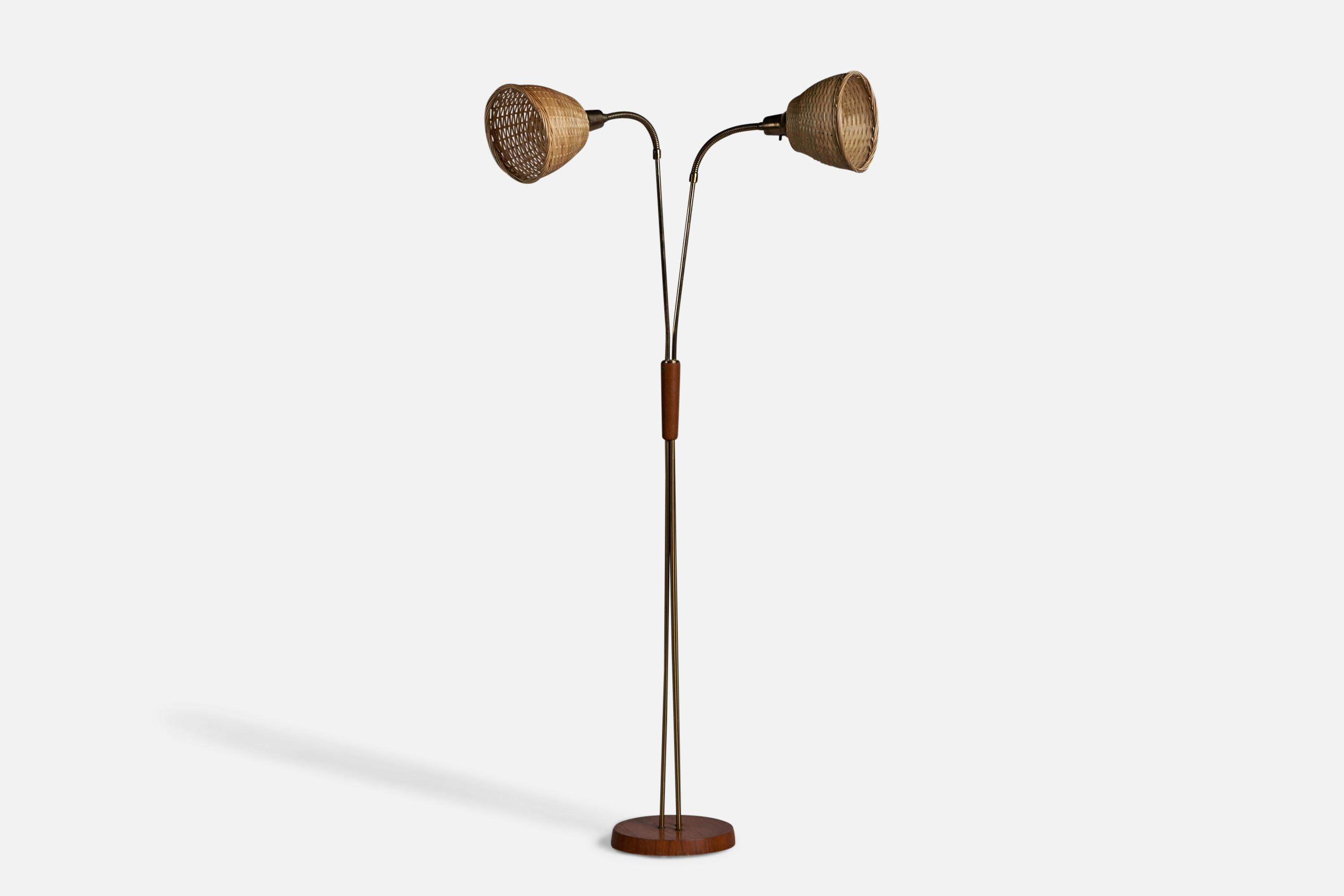An adjustable teak, brass and rattan floor lamp, designed and produced in Sweden, 1950s.

Overall Dimensions (inches): 53.75