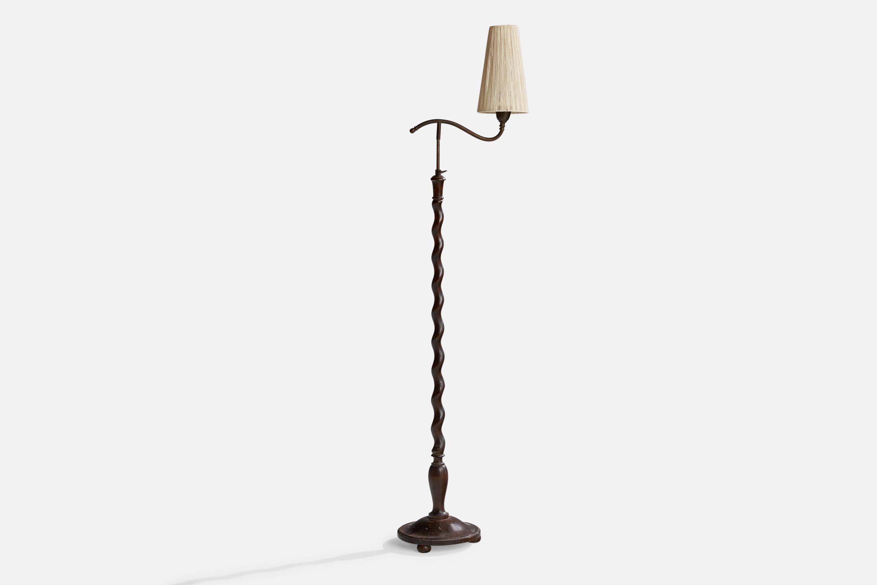 A brass, stained wood and beige string fabric floor lamp designed and produced in Sweden, 1930s.

Dimensions variable.
Overall Dimensions (inches): 59.5” H x 10” W x 16” D
Stated dimensions include shade.
Bulb Specifications: E-26 Bulb
Number of