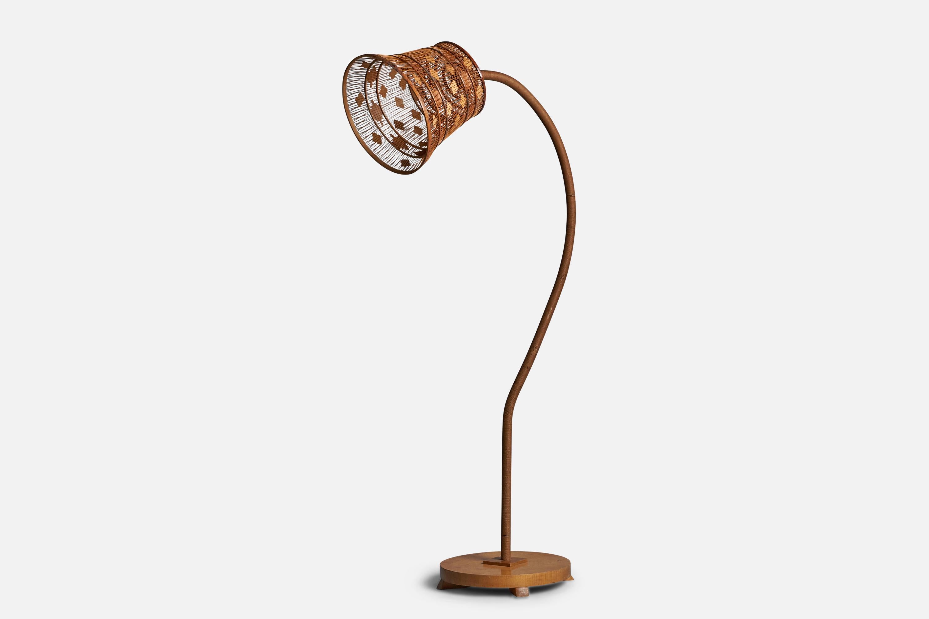 An adjustable cord, elm and wood floor lamp, designed and produced in Sweden, 1930s.

Overall Dimensions (inches): 65” H x 15.25” W x 30” D
Bulb Specifications: E-26 Bulb
Number of Sockets: 1
Condition: Assorted vintage lampshade, socket replaced. 
