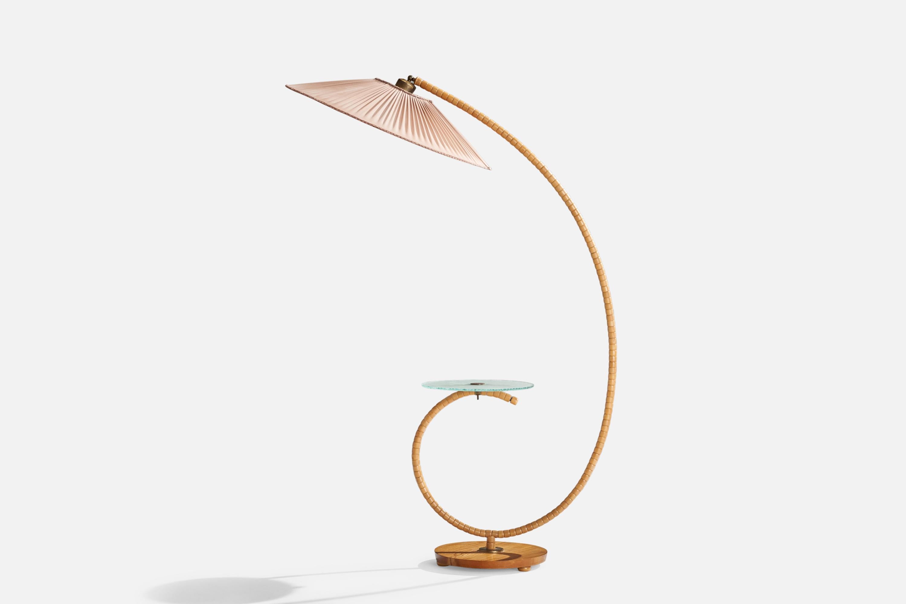 A wood, glass, opaline glass, brass and pink fabric floor lamp or lamp table designed and produced in Sweden, 1930s.

Overall Dimensions (inches): 64.5 H x 30”  W x 45.5” D
Stated dimensions include shade.
Bulb Specifications: E-26 Bulb
Number of