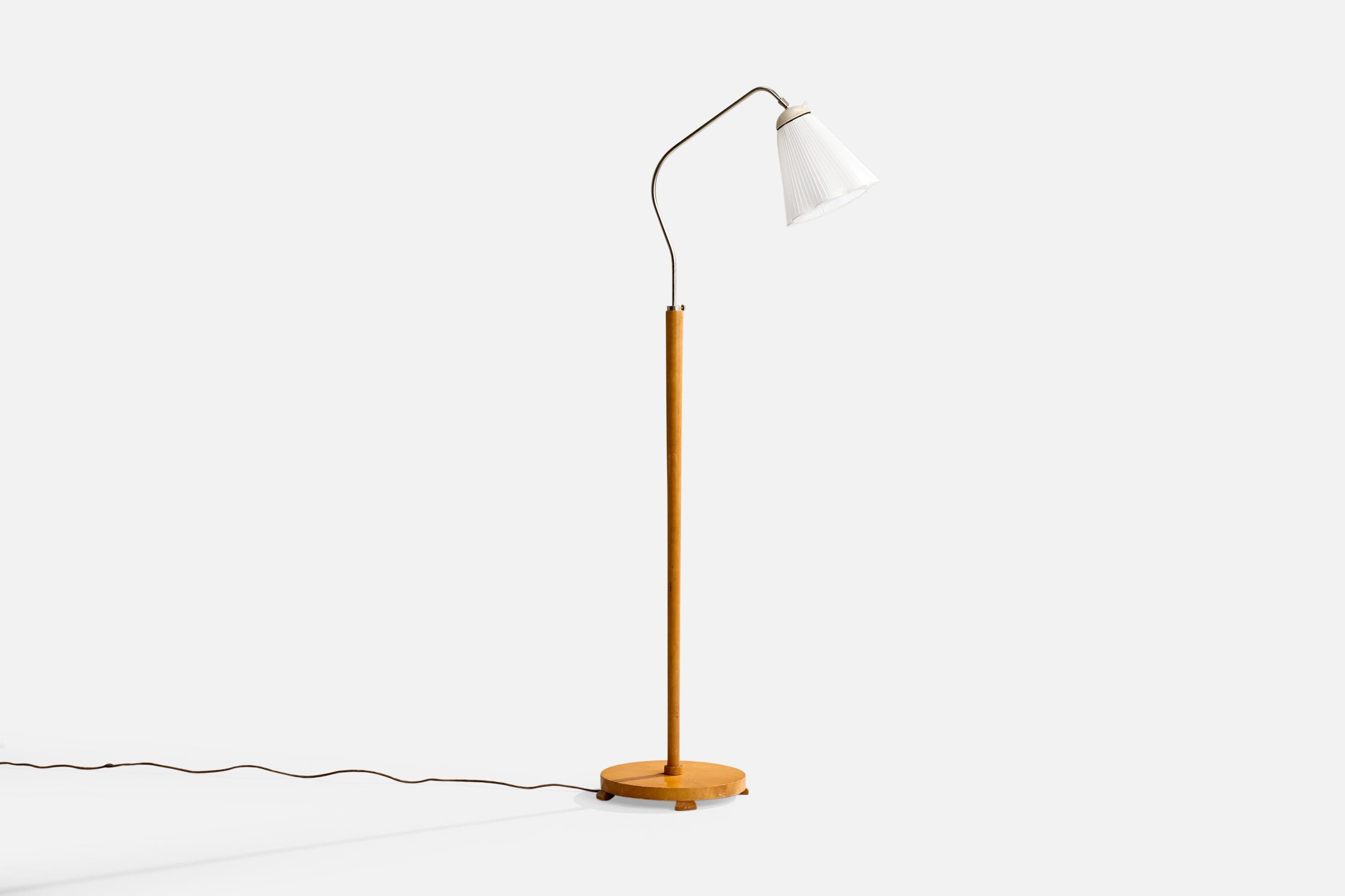 Lampadaire réglable en bois, métal, bakélite et tissu blanc, conçu et produit en Suède, vers les années 1940.

Dimensions de la lampe avec abat-jour (pouces) : 63.0 