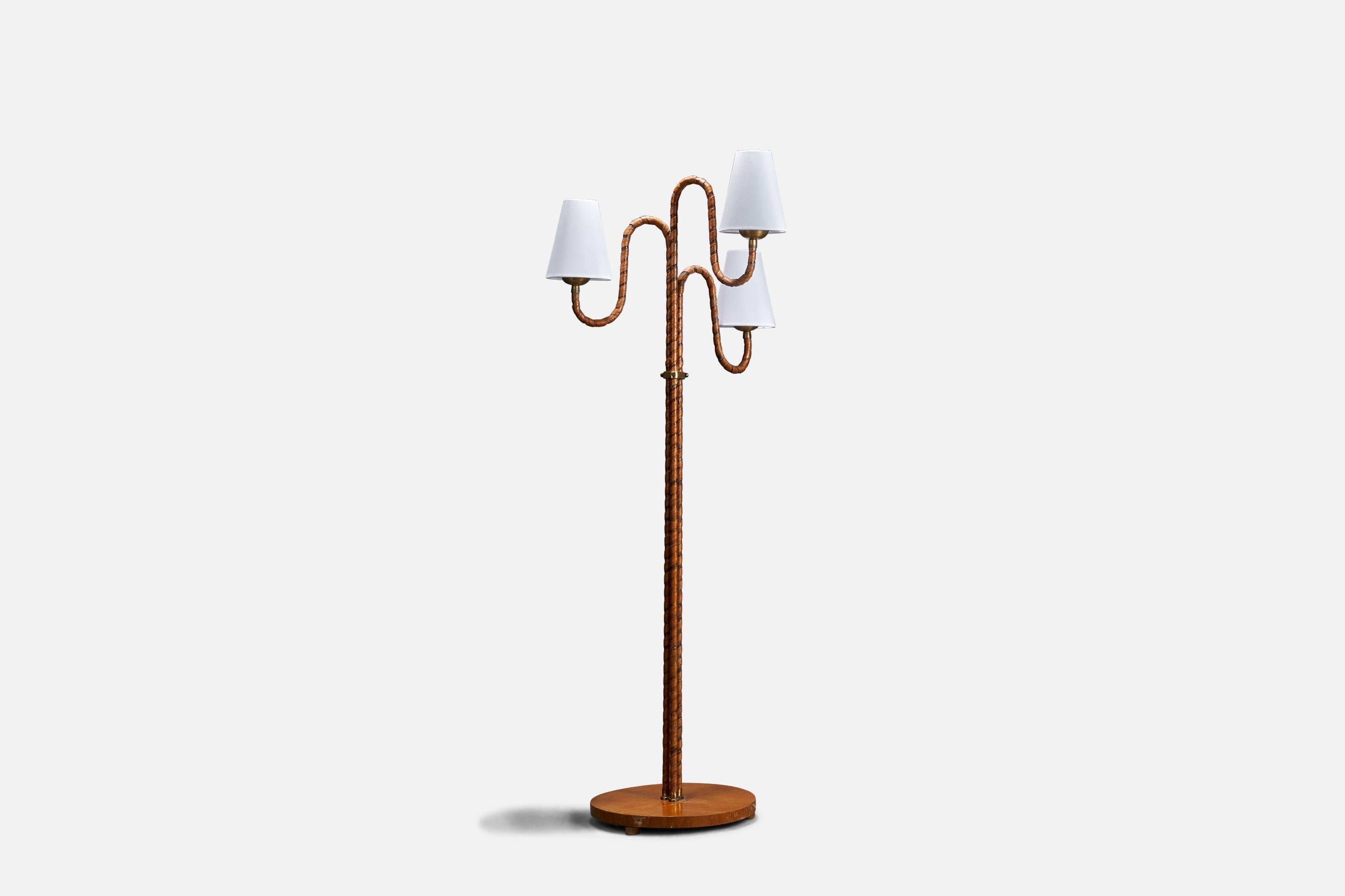 A wood, veneer and brass floor lamp designed and produced in Sweden, 1930s.

Sold with Lampshades. 
Dimensions stated are of Floor Lamp with Lampshades. 

Sockets take standard E-26 medium base bulbs.

There is no maximum wattage stated on
