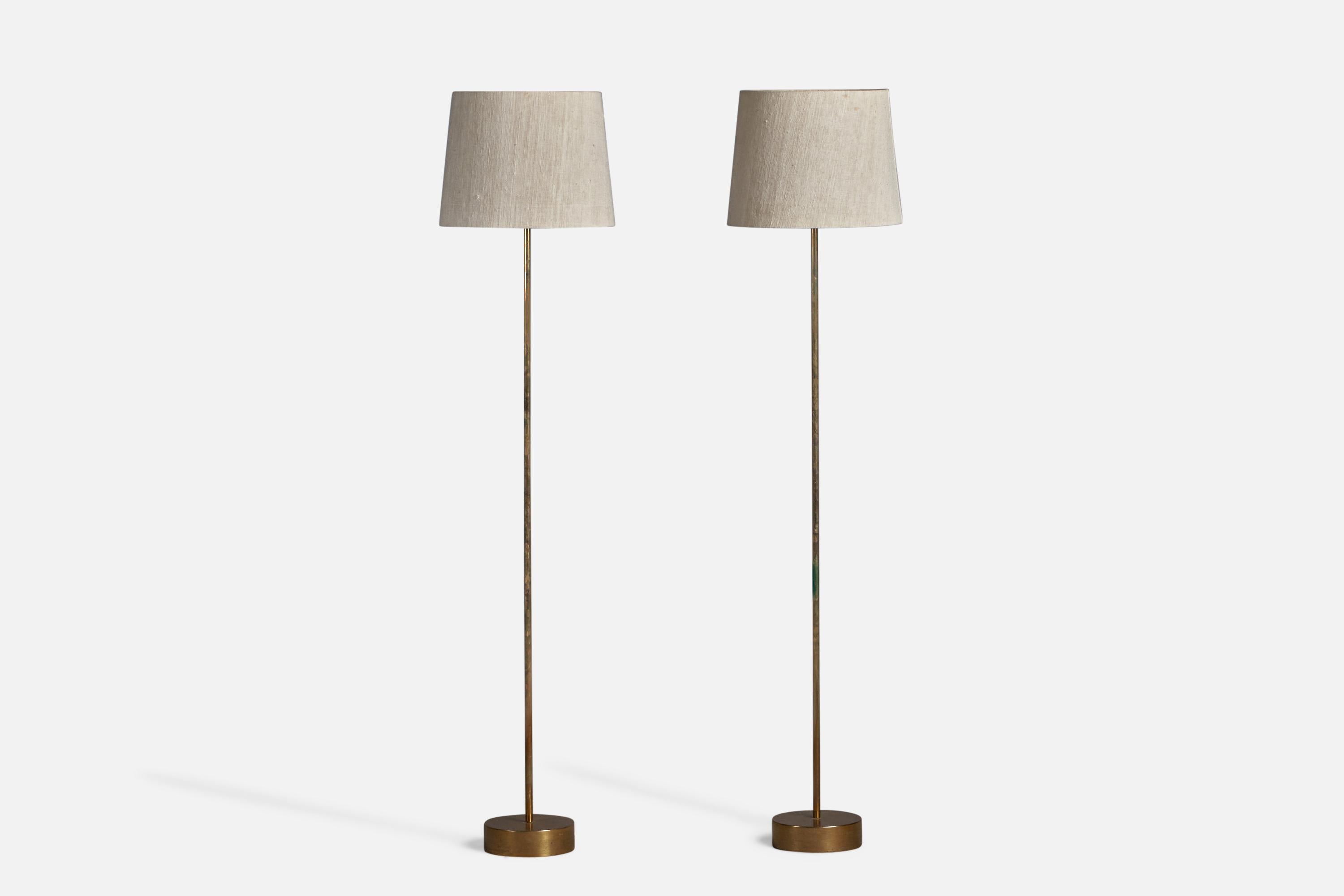A pair of brass, acrylic and woven light beige fabric floor lamps, designed and produced in Sweden, 1950s.

Overall Dimensions (inches): 55.25