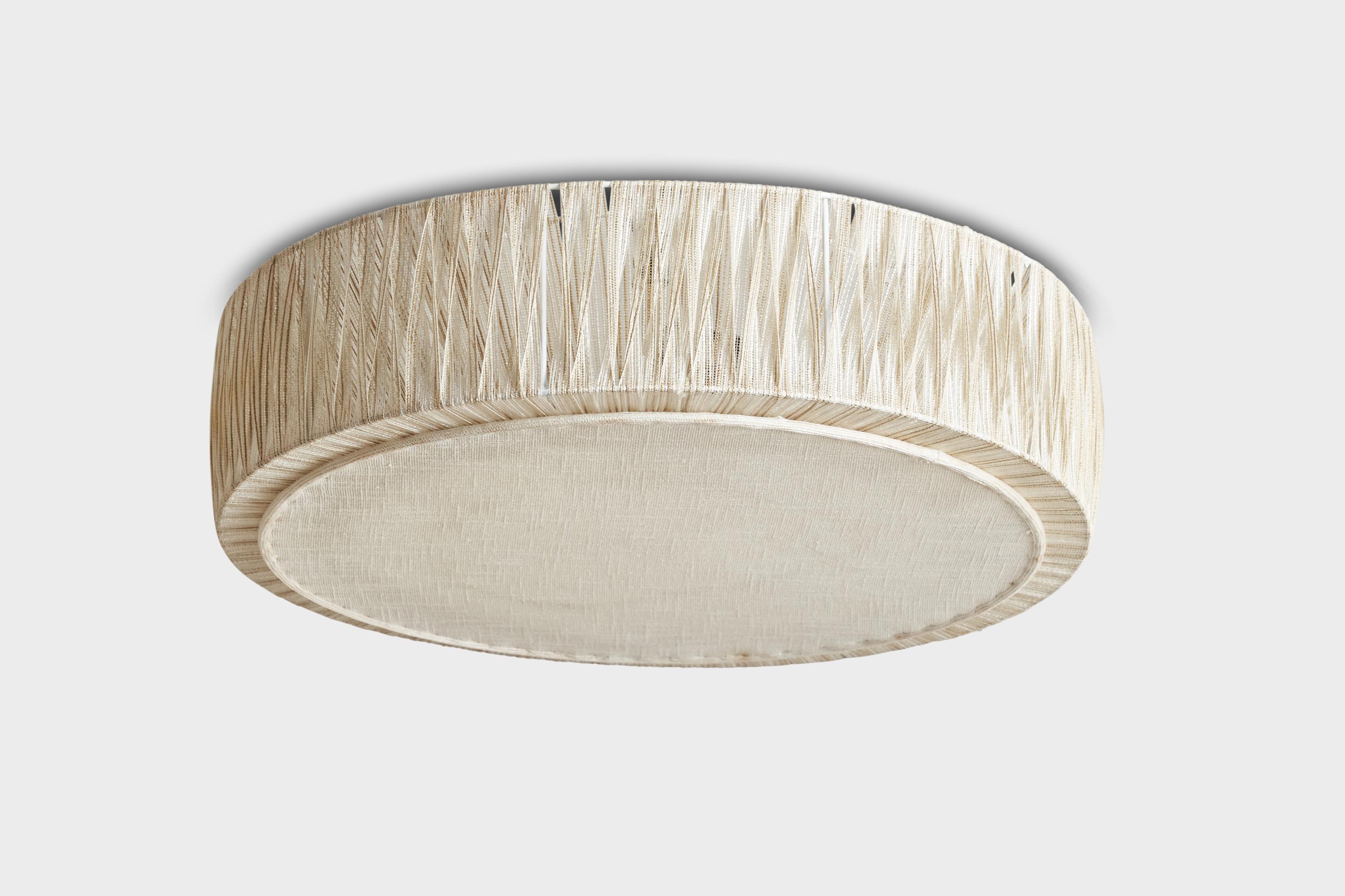 An off-white fabric flush mount designed and produced in Sweden, 1960s.

Dimensions of canopy (inches): N/A
Socket takes standard E-26 bulbs. 2 sockets.There is no maximum wattage stated on the fixture. All lighting will be converted for US usage.