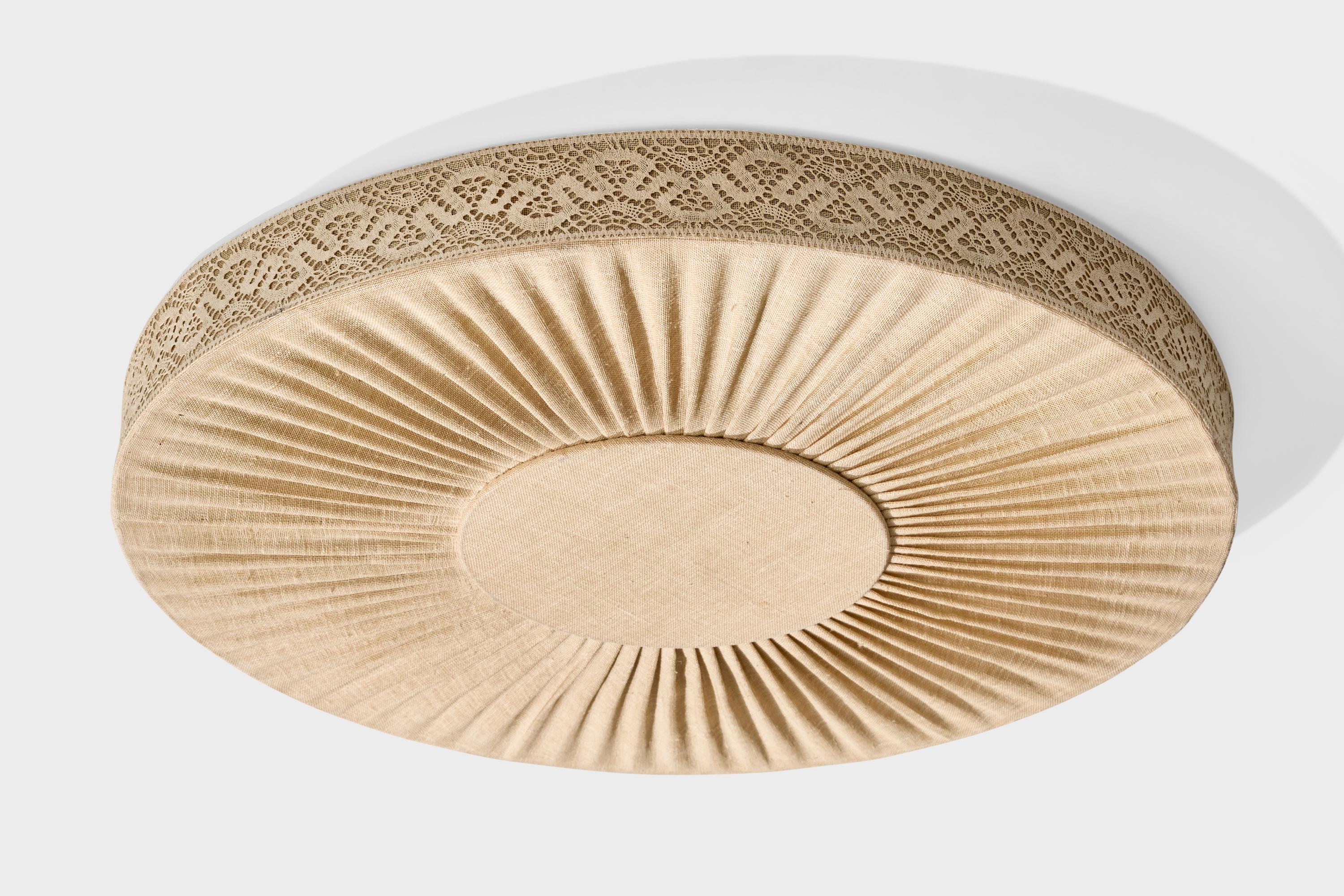 A beige embroidery fabric flush mount designed and produced in Sweden, c. 1950s.

Overall Dimensions (inches): 4.25