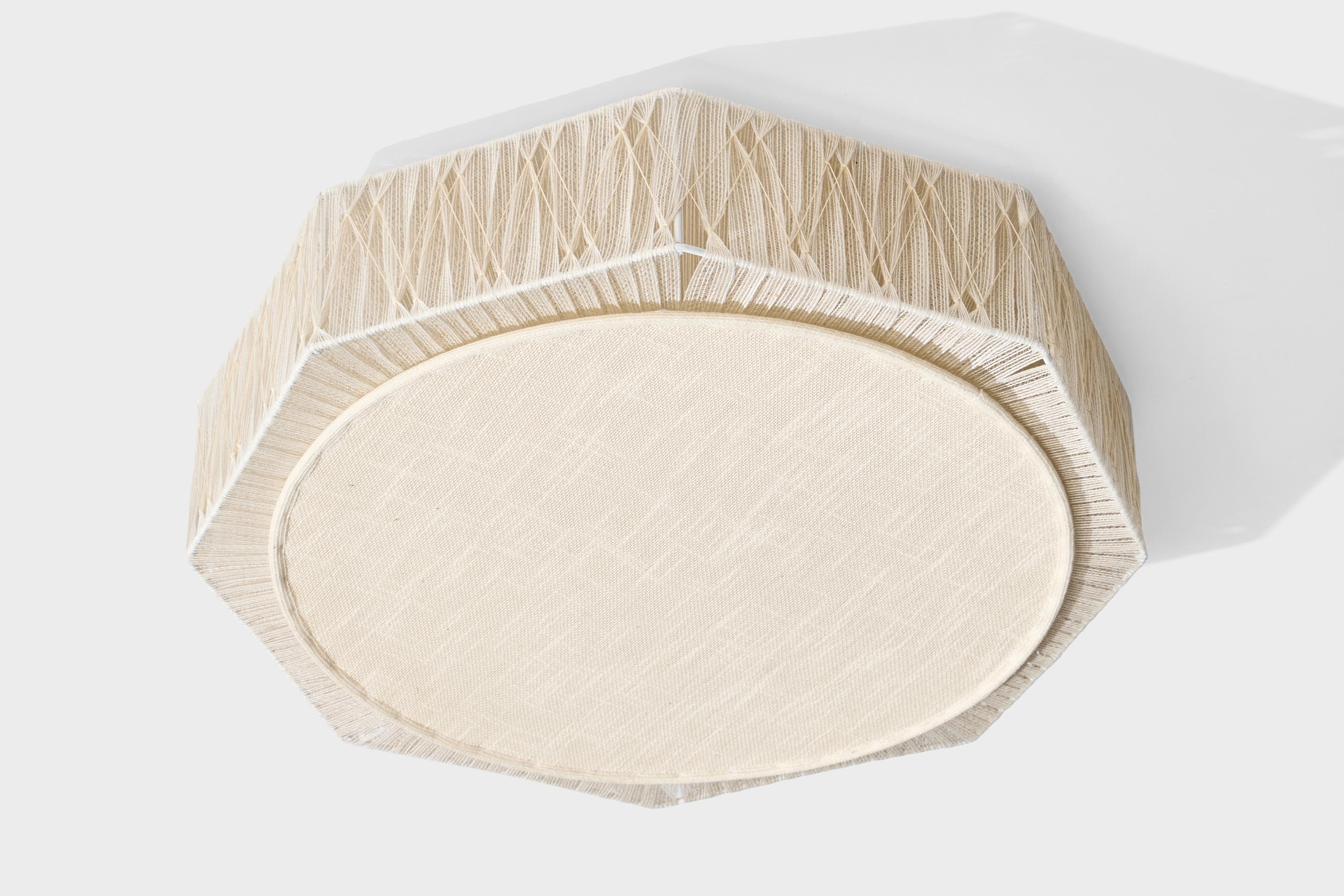 A beige fabric and string fabric flush mount designed and produced in Sweden, c .1970s.

Overall Dimensions (inches): 5.5