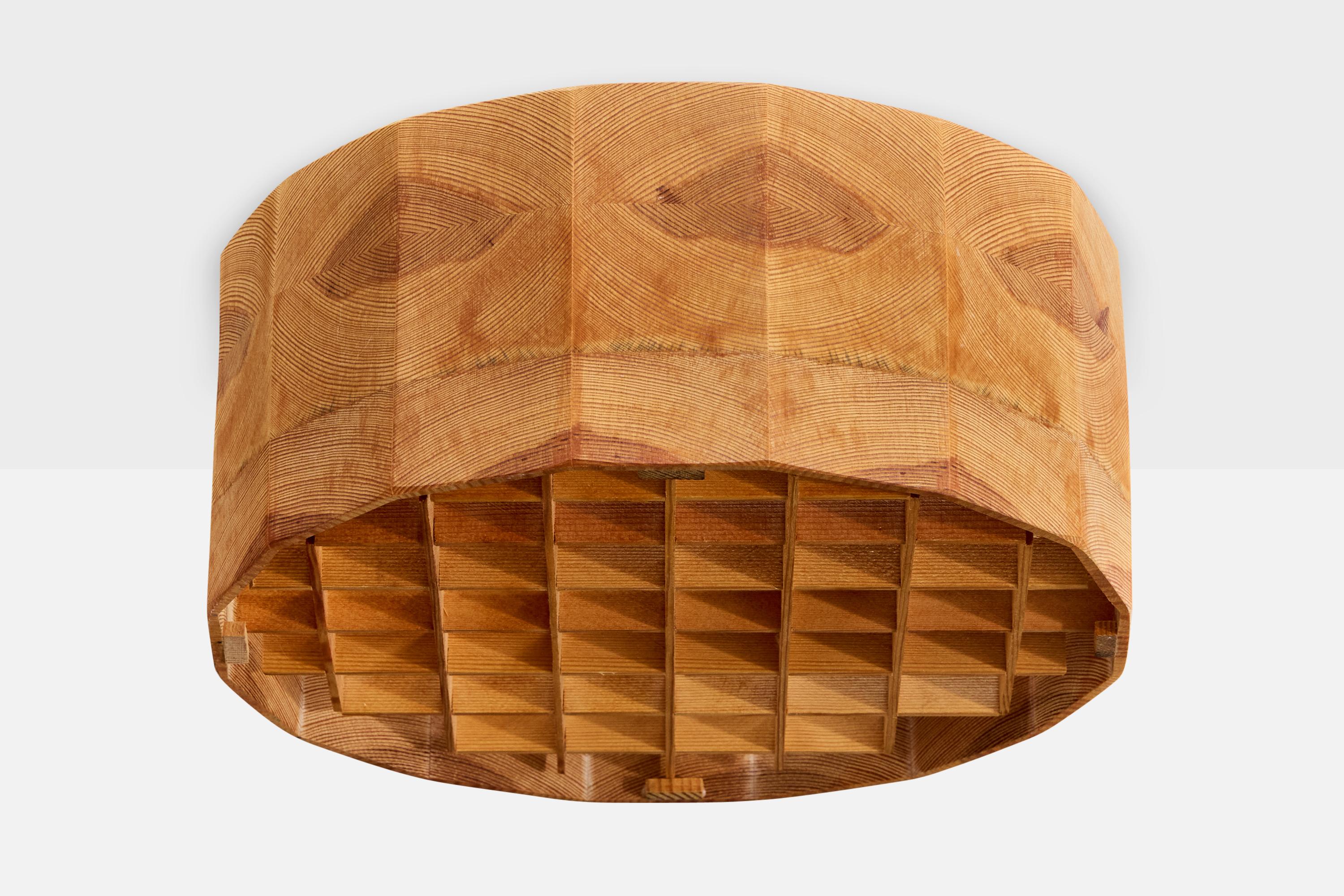 A teak flush mount designed and produced in Sweden, c. 1970s.

Overall Dimensions (inches): 5.5