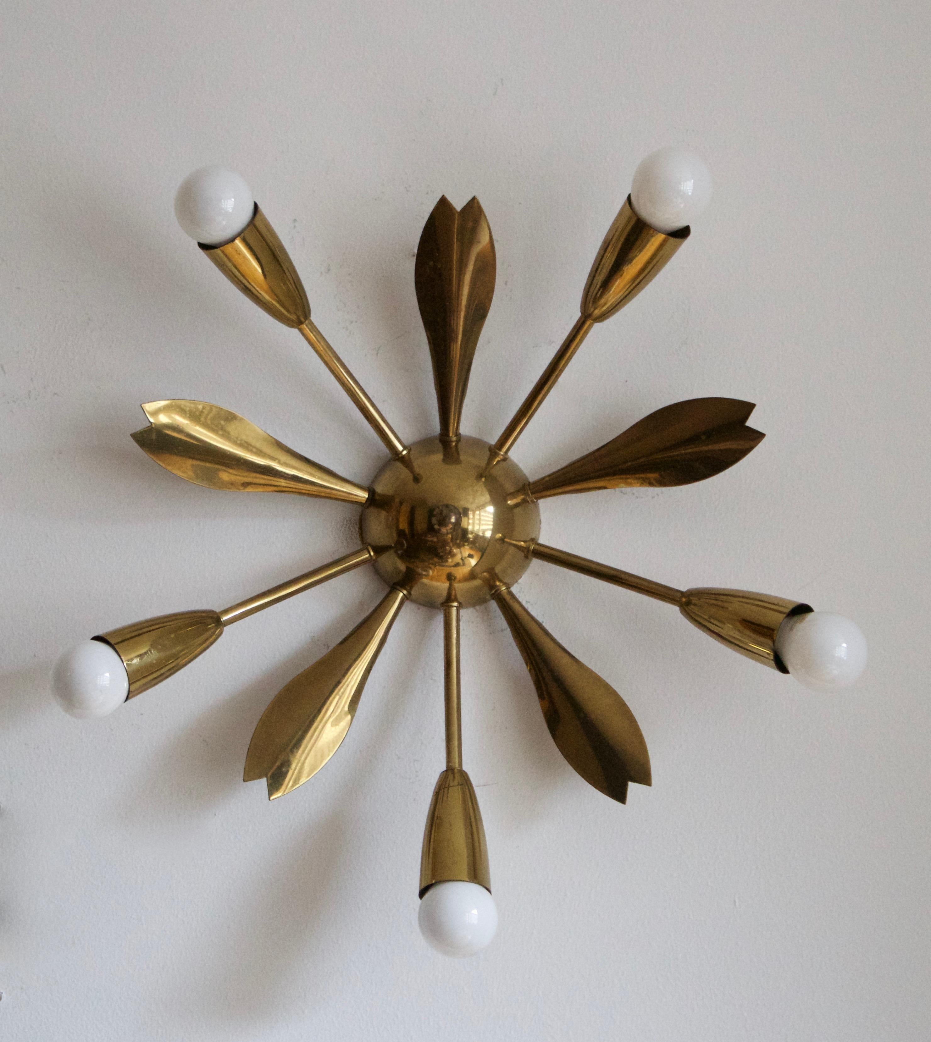 A two armed wall light. designed and produced in Sweden, 1950s. Can also function as flush mount ceiling light.

Stated dimensions with lightbulbs attached.