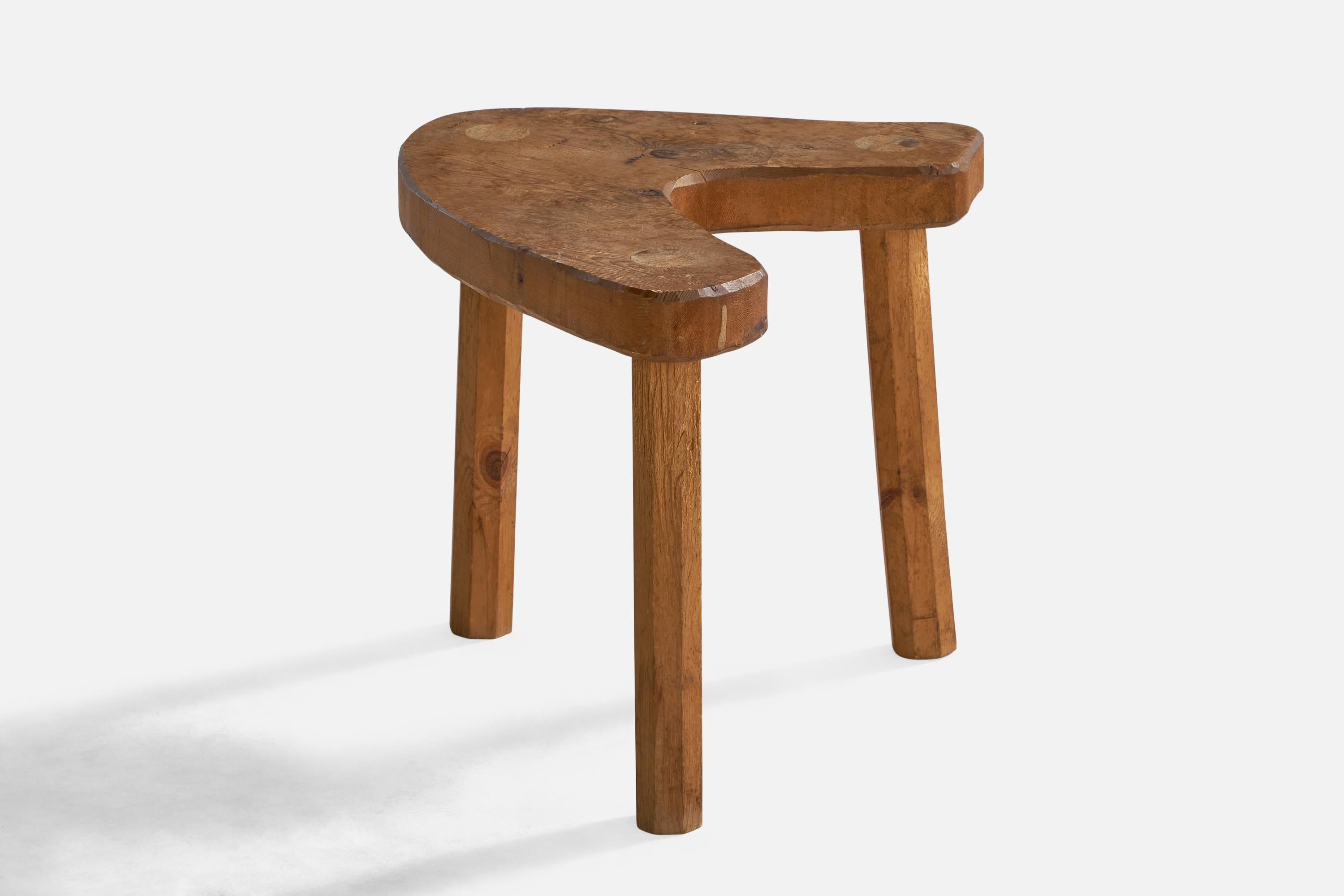 A freeform pine stool designed and produced in Sweden, c. 1960s.

Seat height: 15”