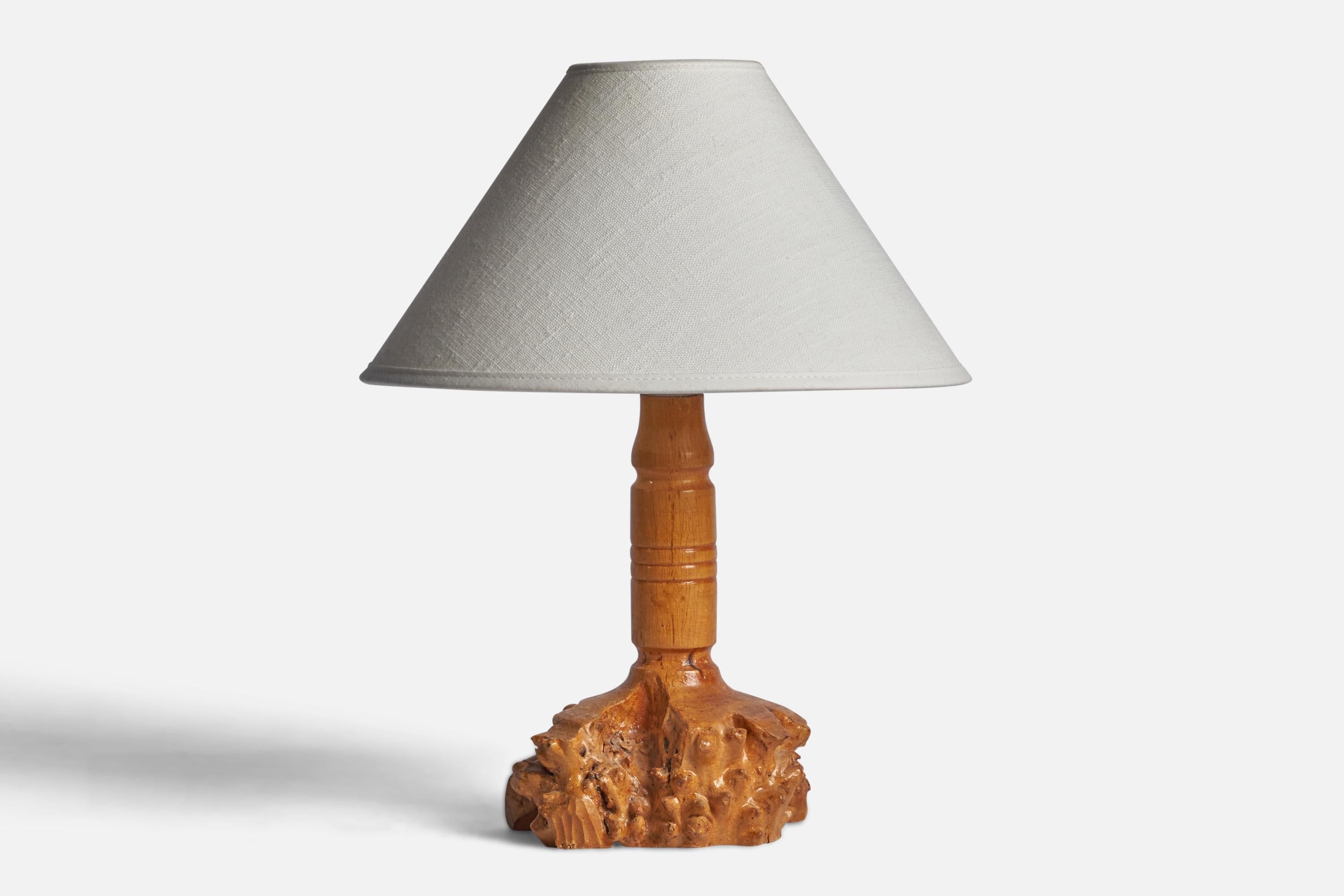 A freeform burl wood table lamp designed and produced in Sweden, c. 1950s.

Dimensions of Lamp (inches): 9.5” H x 5” Diameter
Dimensions of Shade (inches): 2.5” Top Diameter x 10” Bottom Diameter x 5.5