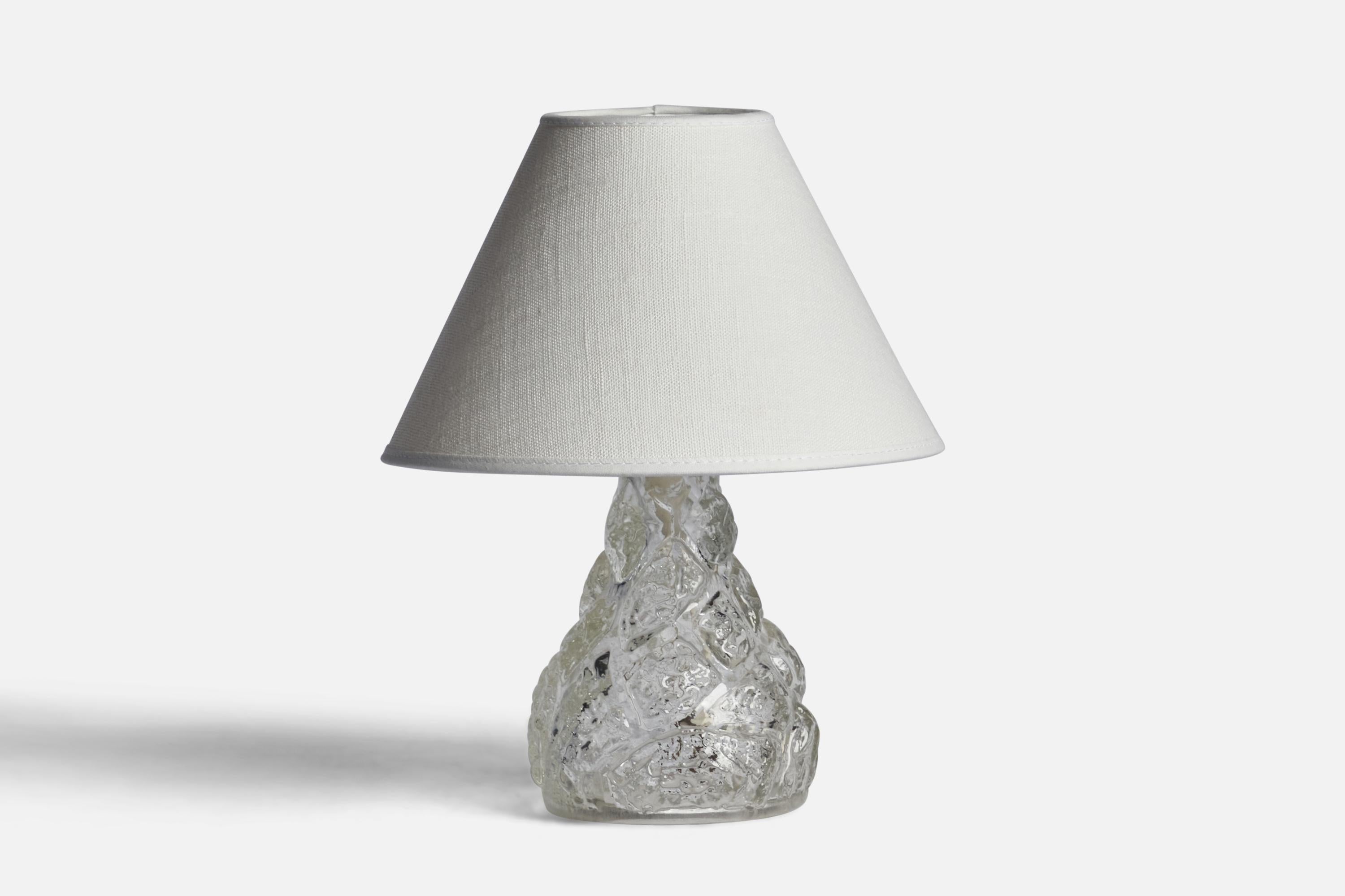 A freeform glass table lamp designed and produced in Sweden, 1940s.

Dimensions of Lamp (inches): 7.35” H x 4.15” Diameter
Dimensions of Shade (inches): 3” Top Diameter x 8” Bottom Diameter x 5” H 
Dimensions of Lamp with Shade (inches): 10.15” H x