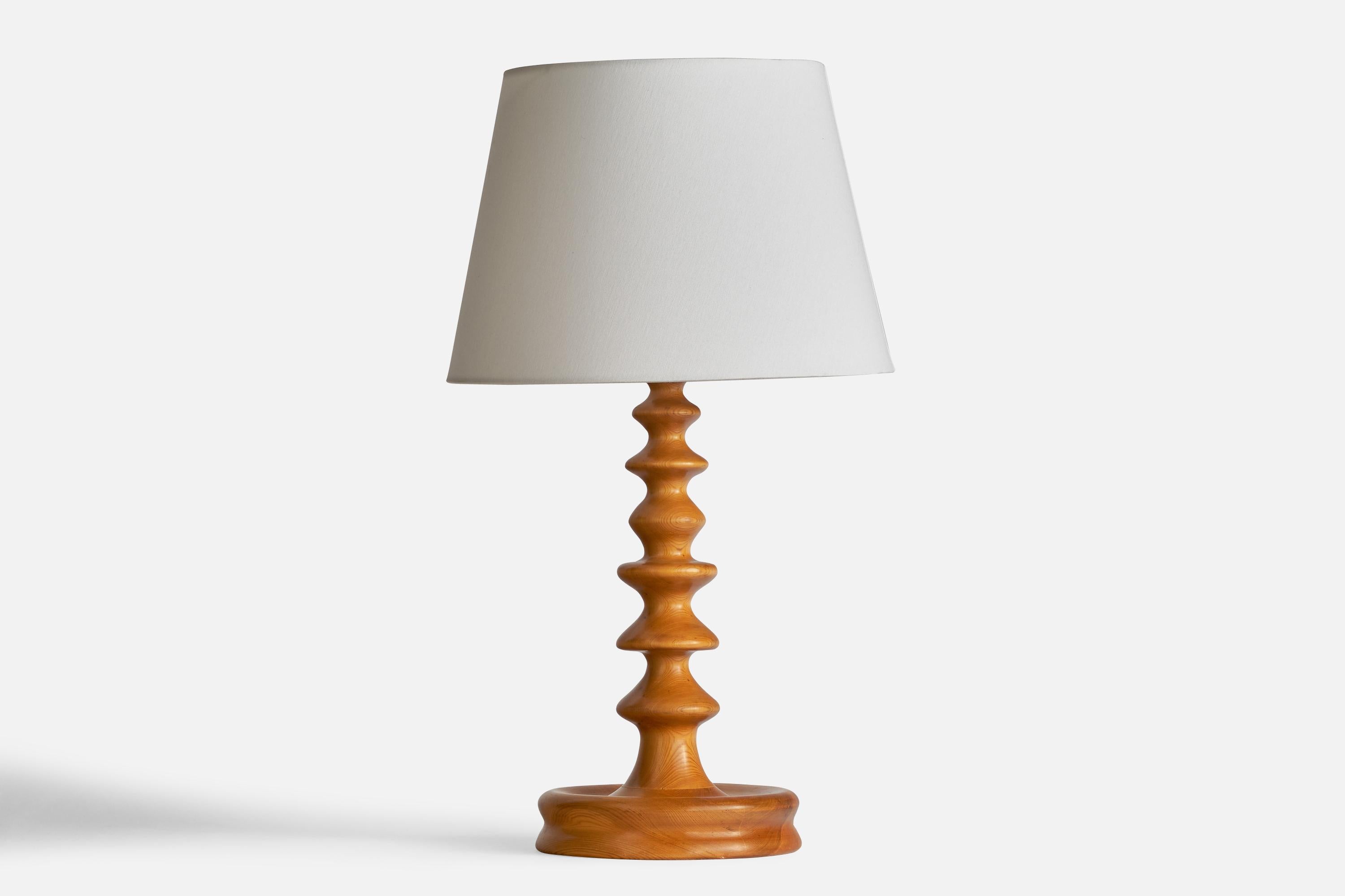 A freeform pine table lamp designed and produced in Sweden, c. 1960s.

Dimensions of Lamp (inches): 19” H x 8” Diameter
Dimensions of Shade (inches): 10