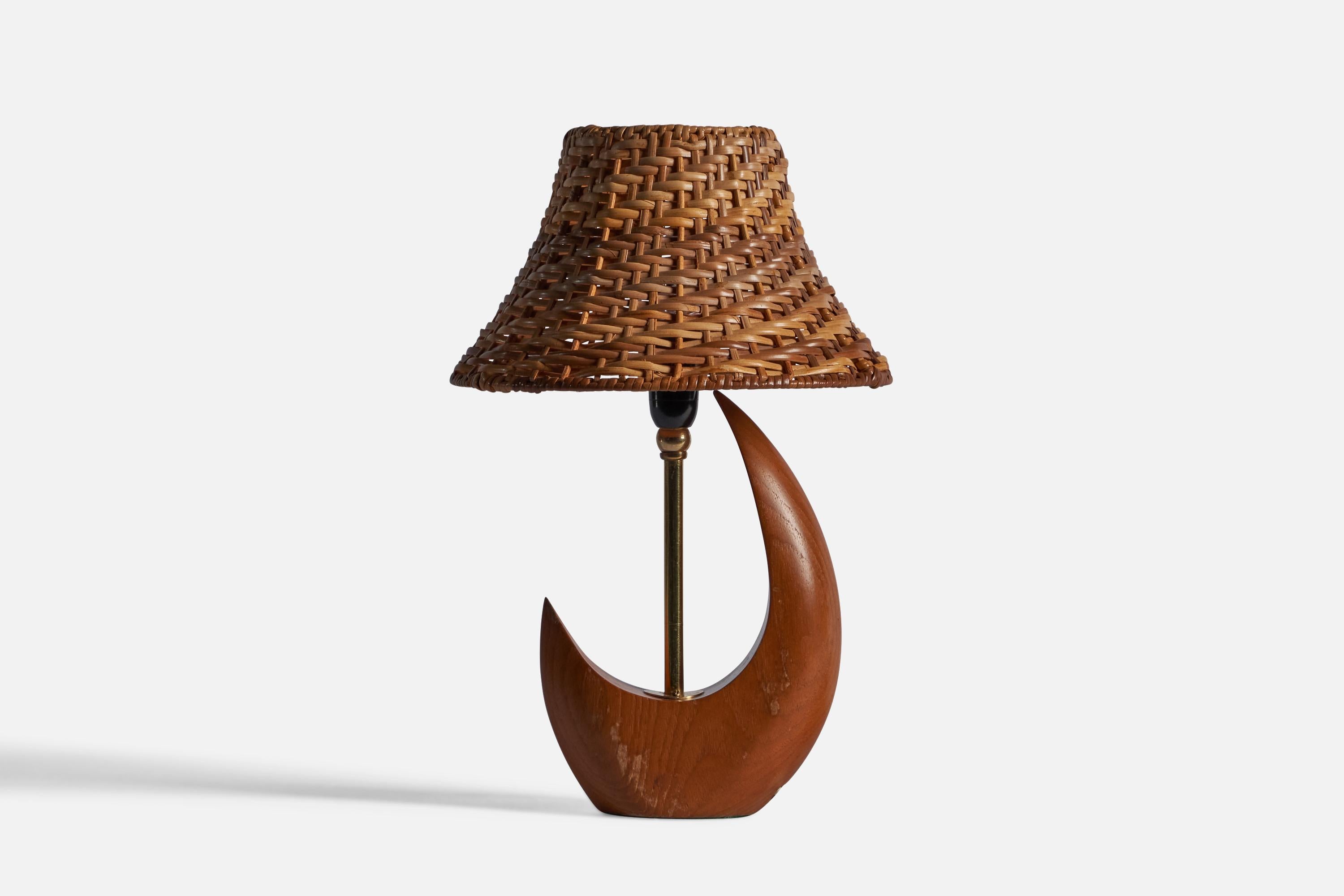 A teak, brass, and rattan table lamp, designed and produced in Sweden, c. 1950s.

Overall Dimensions: 13.75