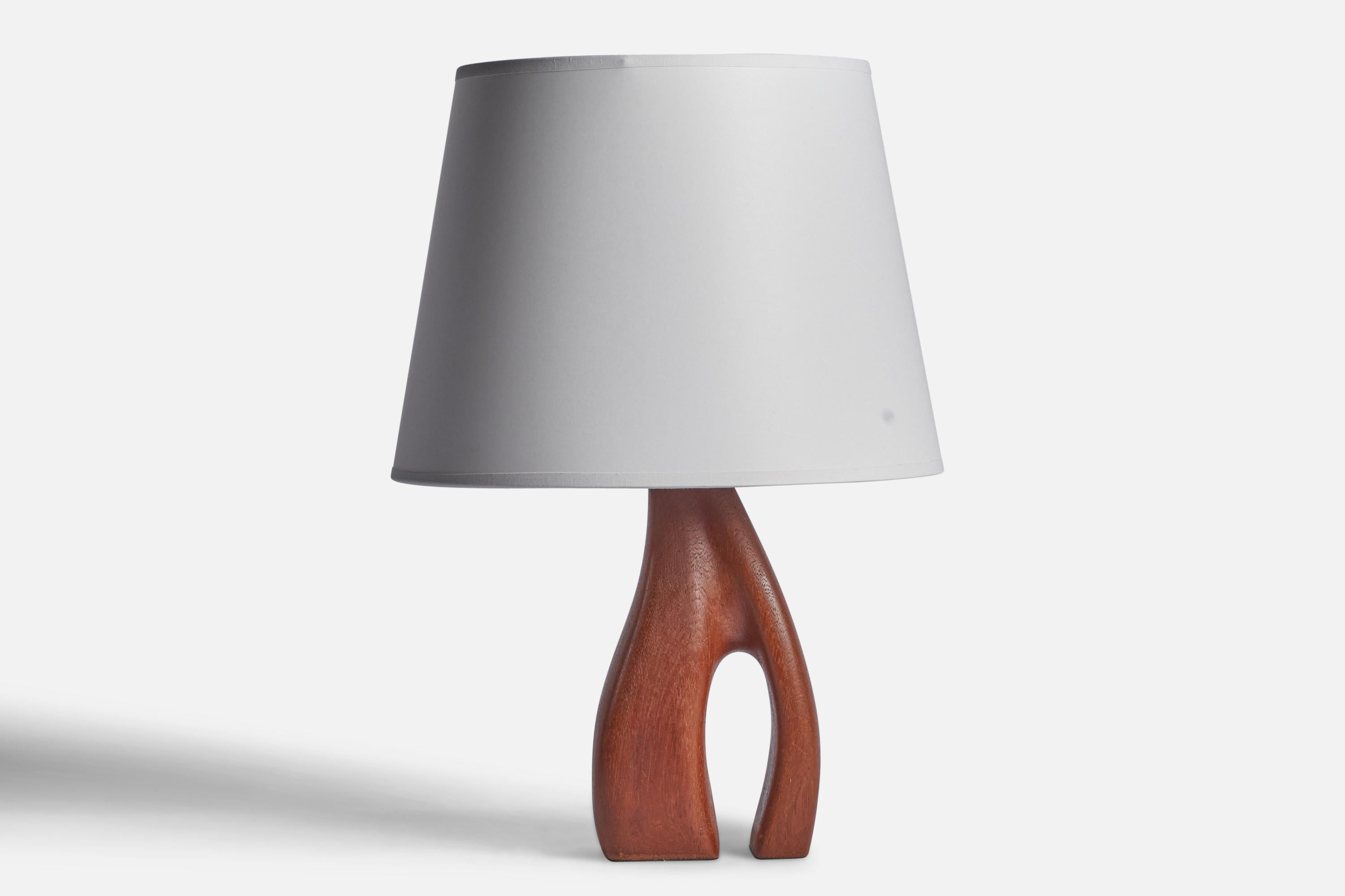 A freeform teak table lamp designed and produced in Sweden, 1950s.

Dimensions of Lamp (inches): 8.5” H x 4.75” Diameter
Dimensions of Shade (inches): 8.75” Top Diameter x 12” Bottom Diameter x 9” H 
Dimensions of Lamp with Shade (inches): 15” H x