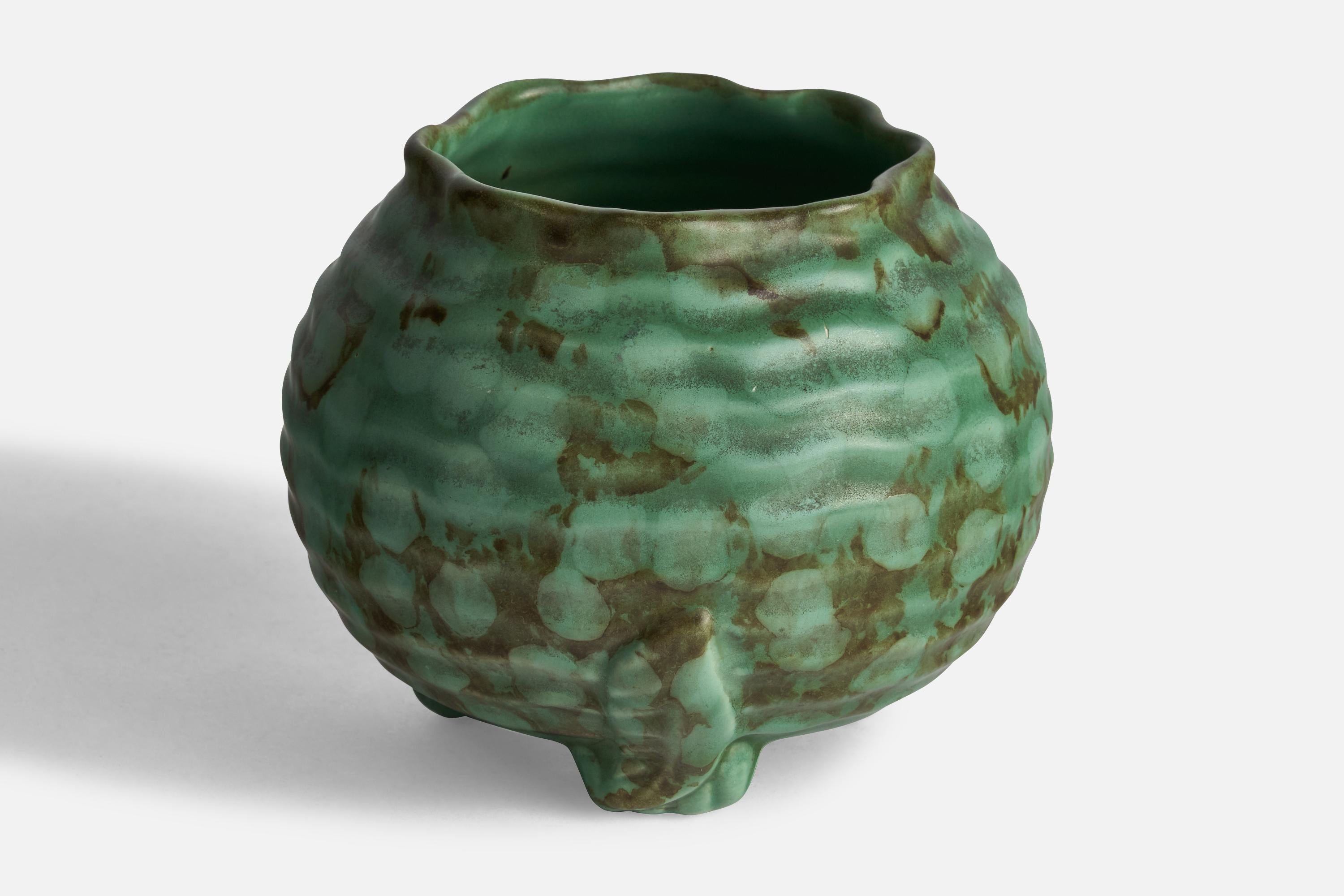 A green-glazed freeform vase designed and produced in Sweden, 1930s.