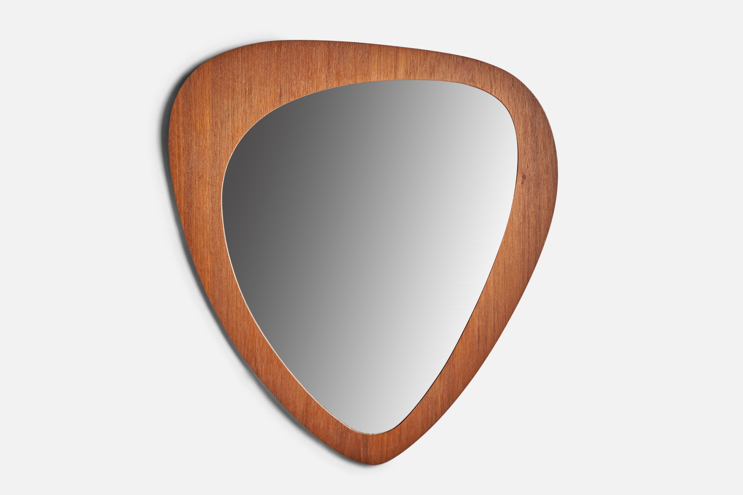 A thin teak-veneered freeform wall mirror designed and produced in Sweden, 1950s.
