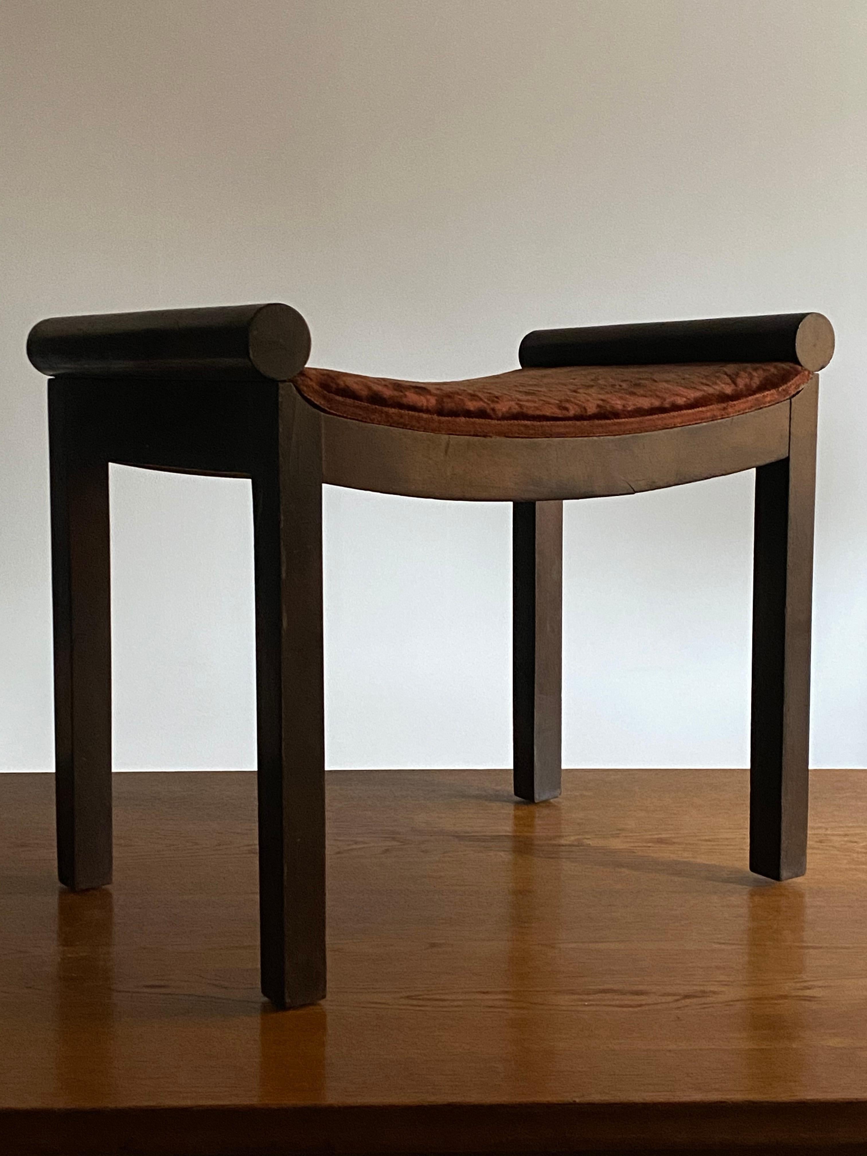 A functionalist / Art Deco stool of Swedish production and design. In dark stained wood. Original red velvet in need of replacement. 

Other designers of the period include Axel Einar Hjorth, Pierre Chareau, Eugène Printz, Josef Hoffman.