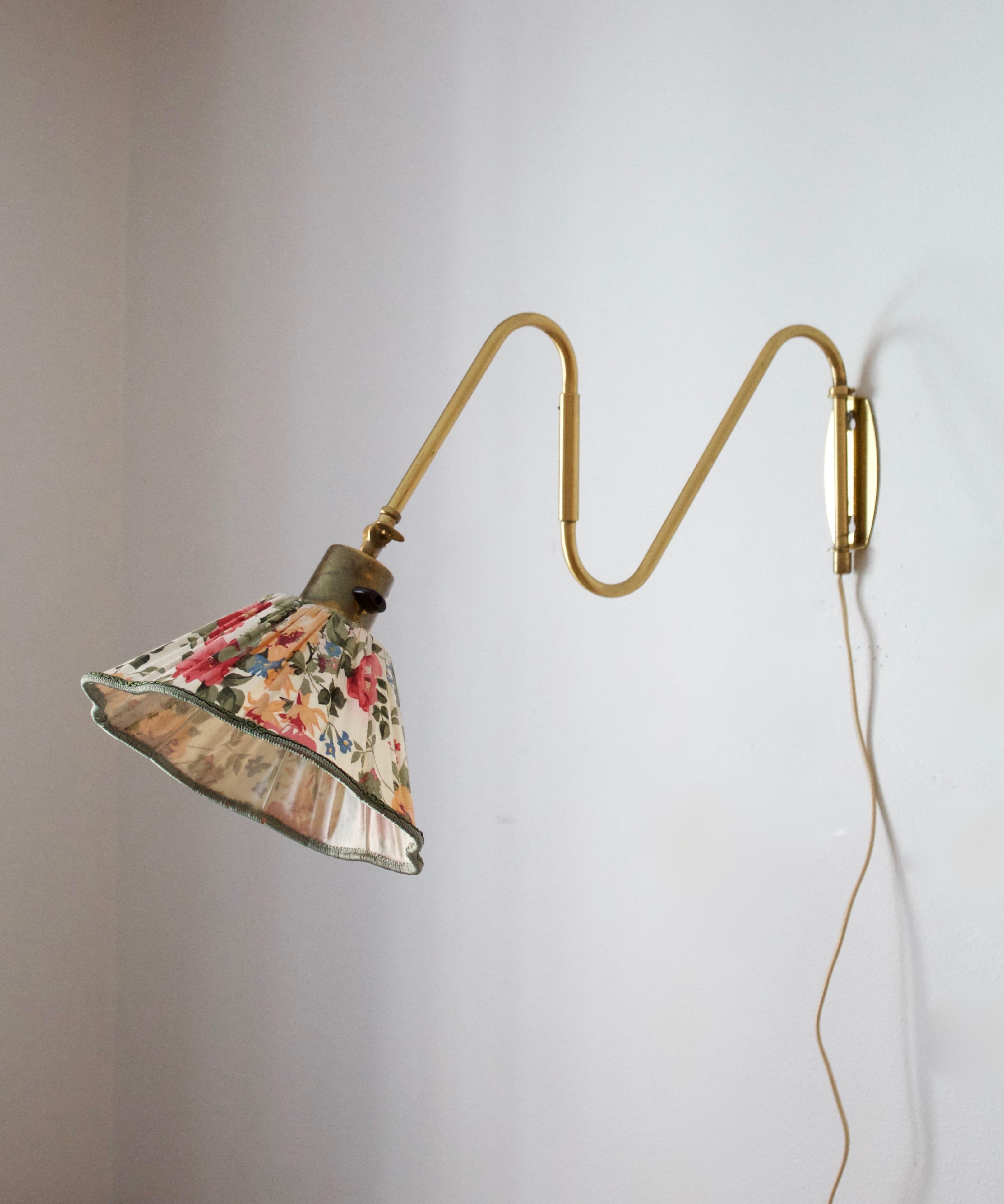 A functionalist wall light / task light, designed and produced in Sweden, 1940s-1950s. Vintage floral print lampshade.

Stated dimensions with lampshade attached. Measurements variable.