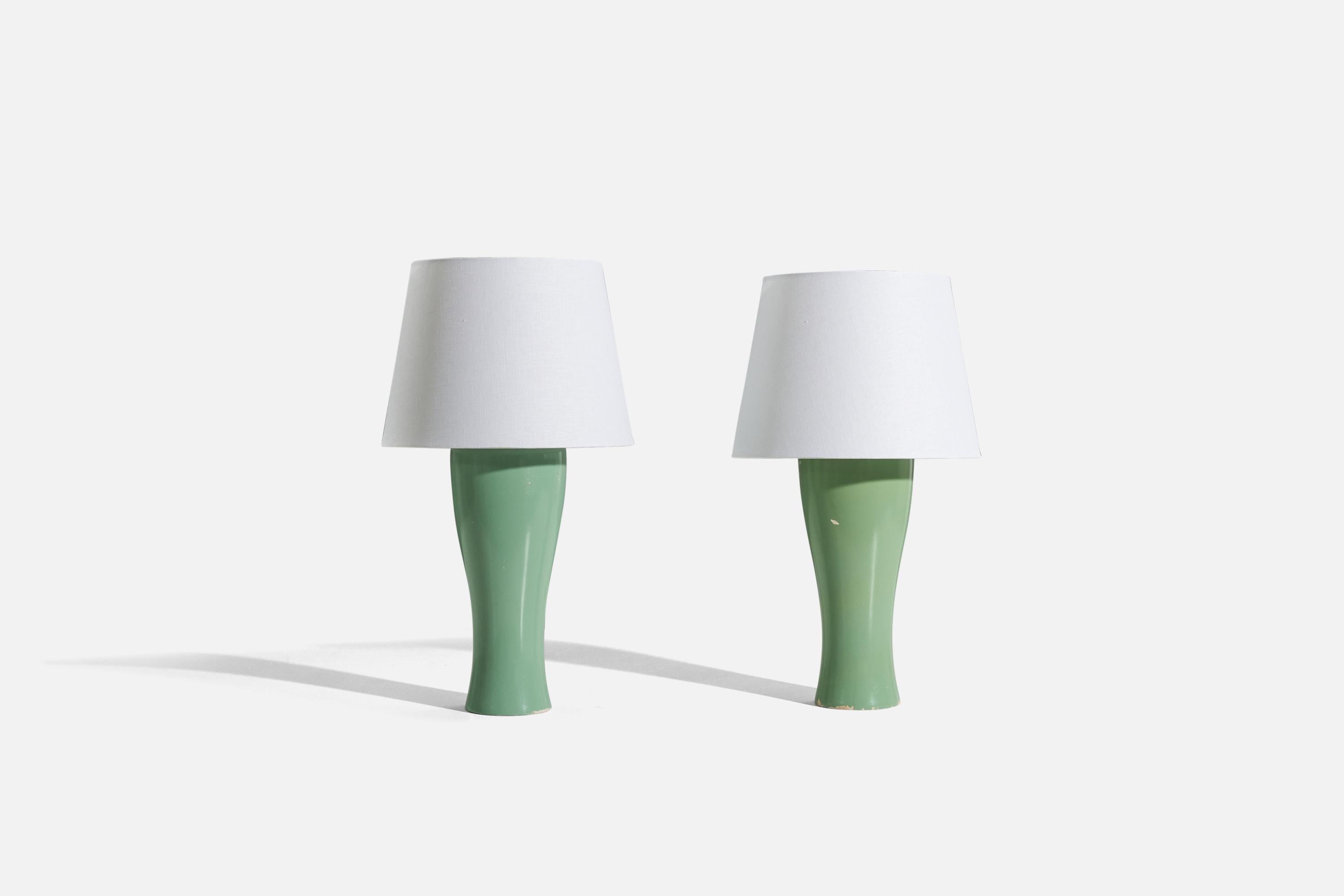 A pair of green lacquered wooden table lamps, designed and produced by a Swedish designer, Sweden, c. 1970s.

Sold without lampshade. 
Dimensions of lamp (inches) : 17.1875 x 5.25 x 5.25 (H x W x D)
Dimensions of shade (inches) : 9.125 x 12.125