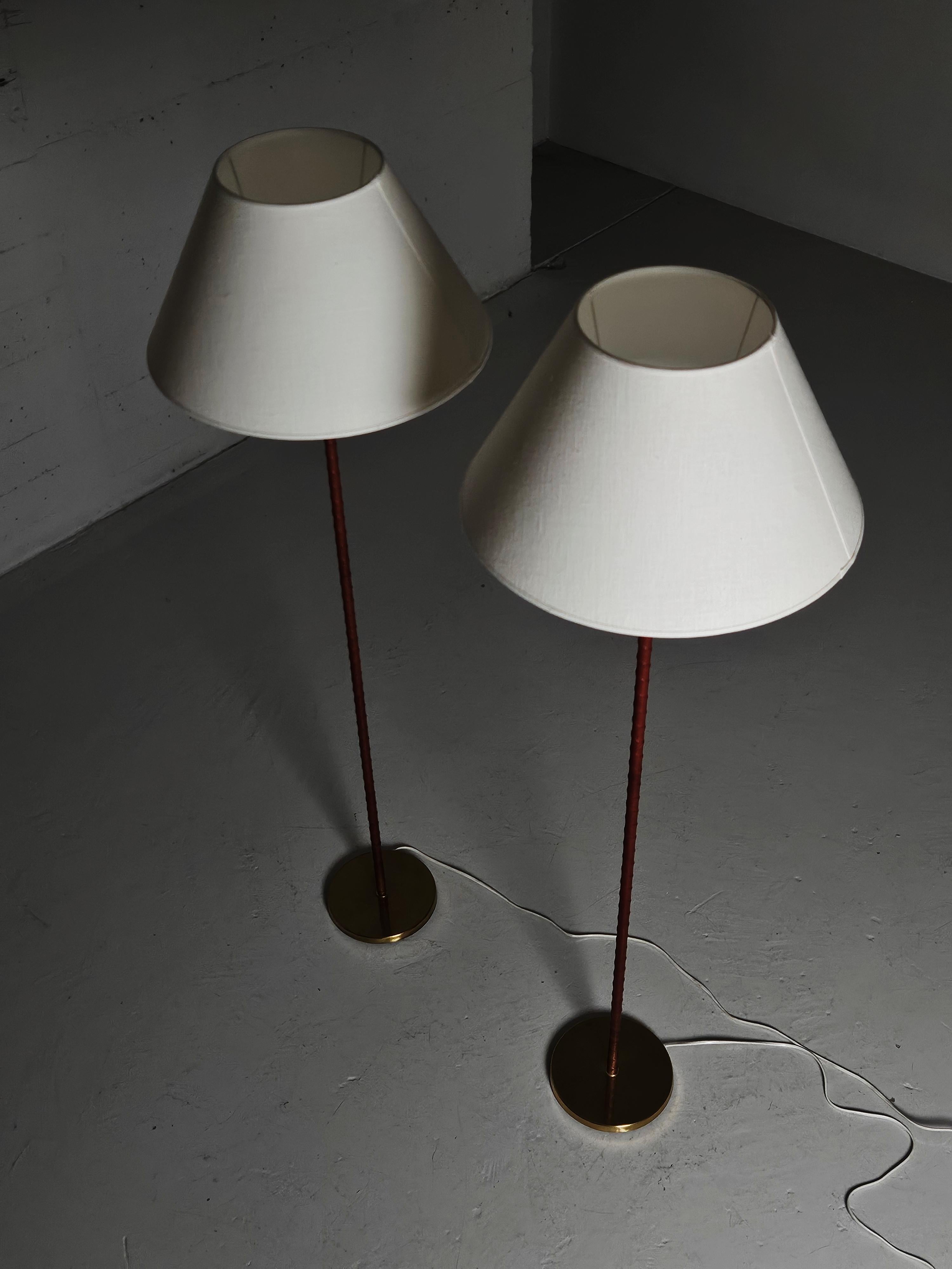 Scandinavian Modern Swedish designer leather and brass floor lamps by MAE, Sweden, 1950s