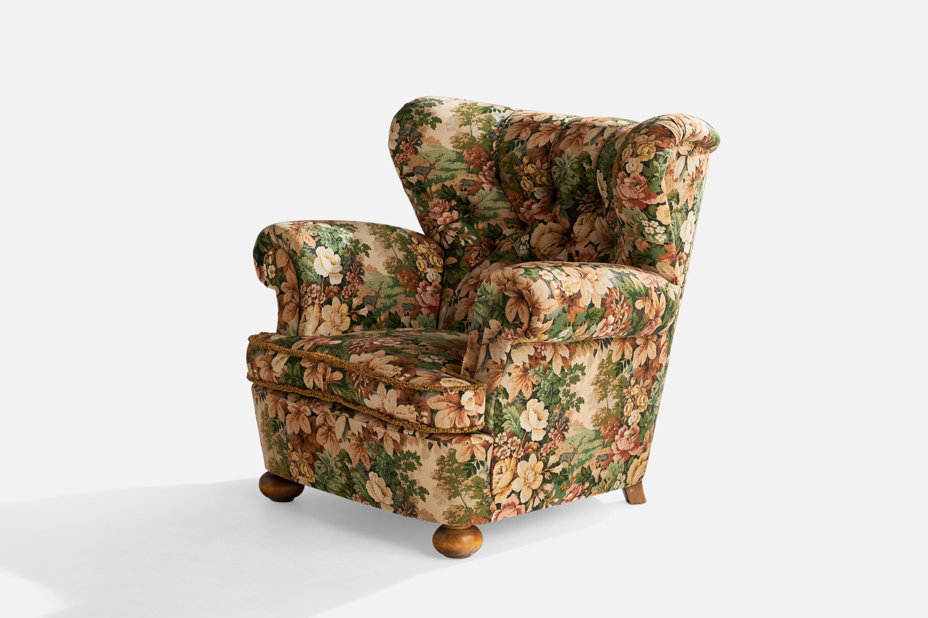 A floral fabric and wood lounge chair designed and produced in Sweden, c. 1930s.

Seat height 16”
