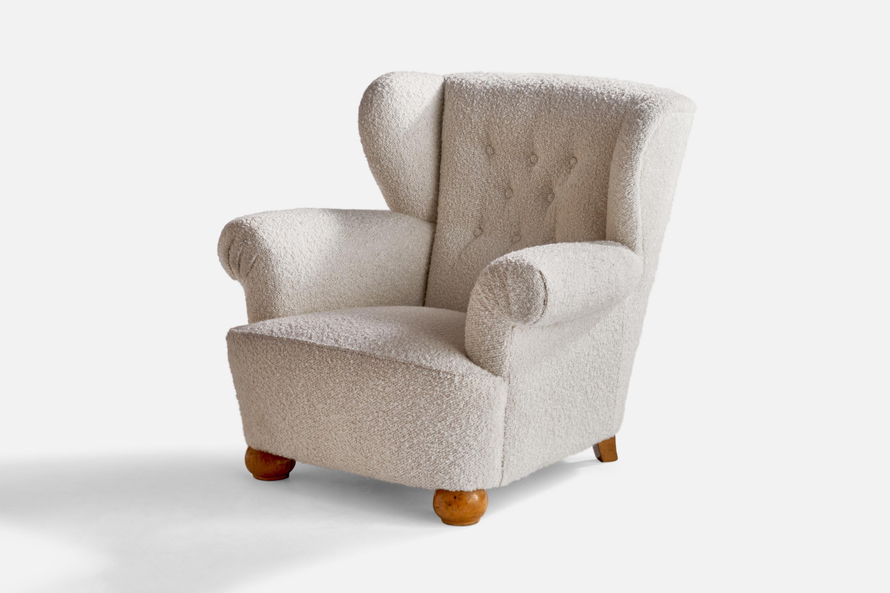 A white bouclé fabric and oak lounge chair designed and produced in Sweden, 1940s.

Seat height is 15”