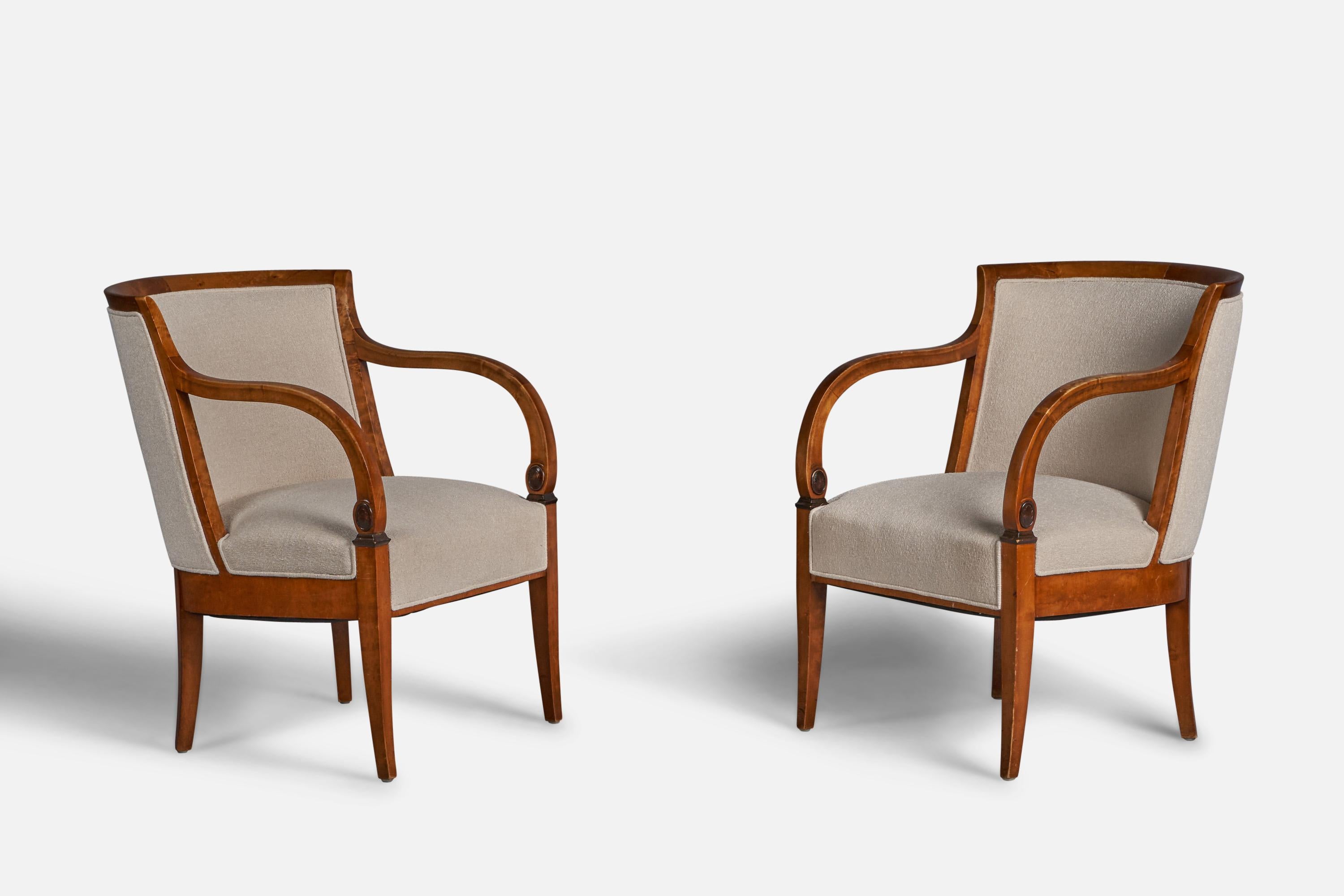 A pair of birch and off-white fabric lounge chairs designed and produced in Sweden, c. 1920s.

18” seat height

