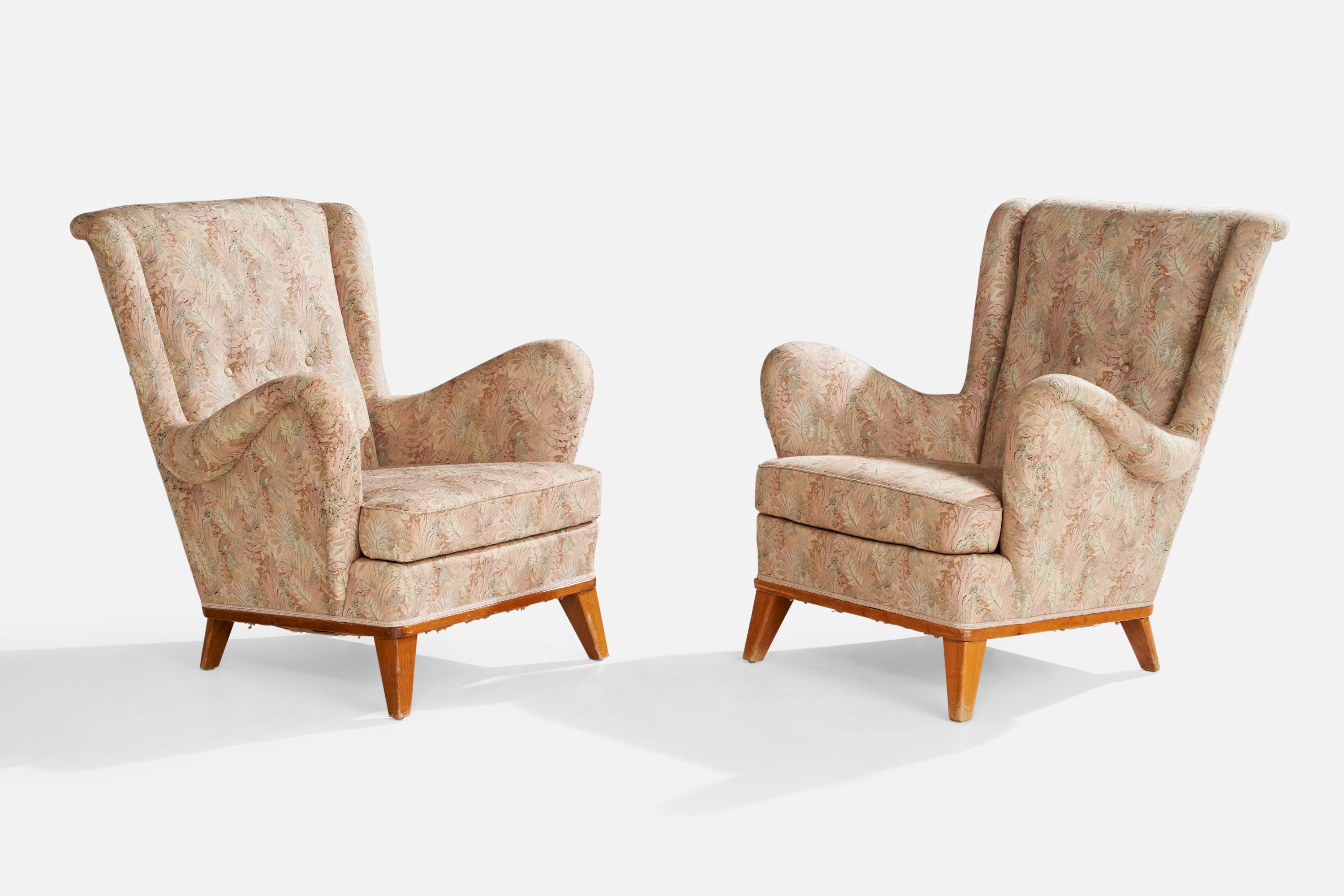 A pair of oak and floral printed fabric lounge chairs designed and produced in Sweden, c. 1940s.

Dimensions: 35.5” H x 31.5” W x 35” D

Seat Height: 15.5” 

All upholstered furniture can be reupholstered upon request for an additional fee. Lead