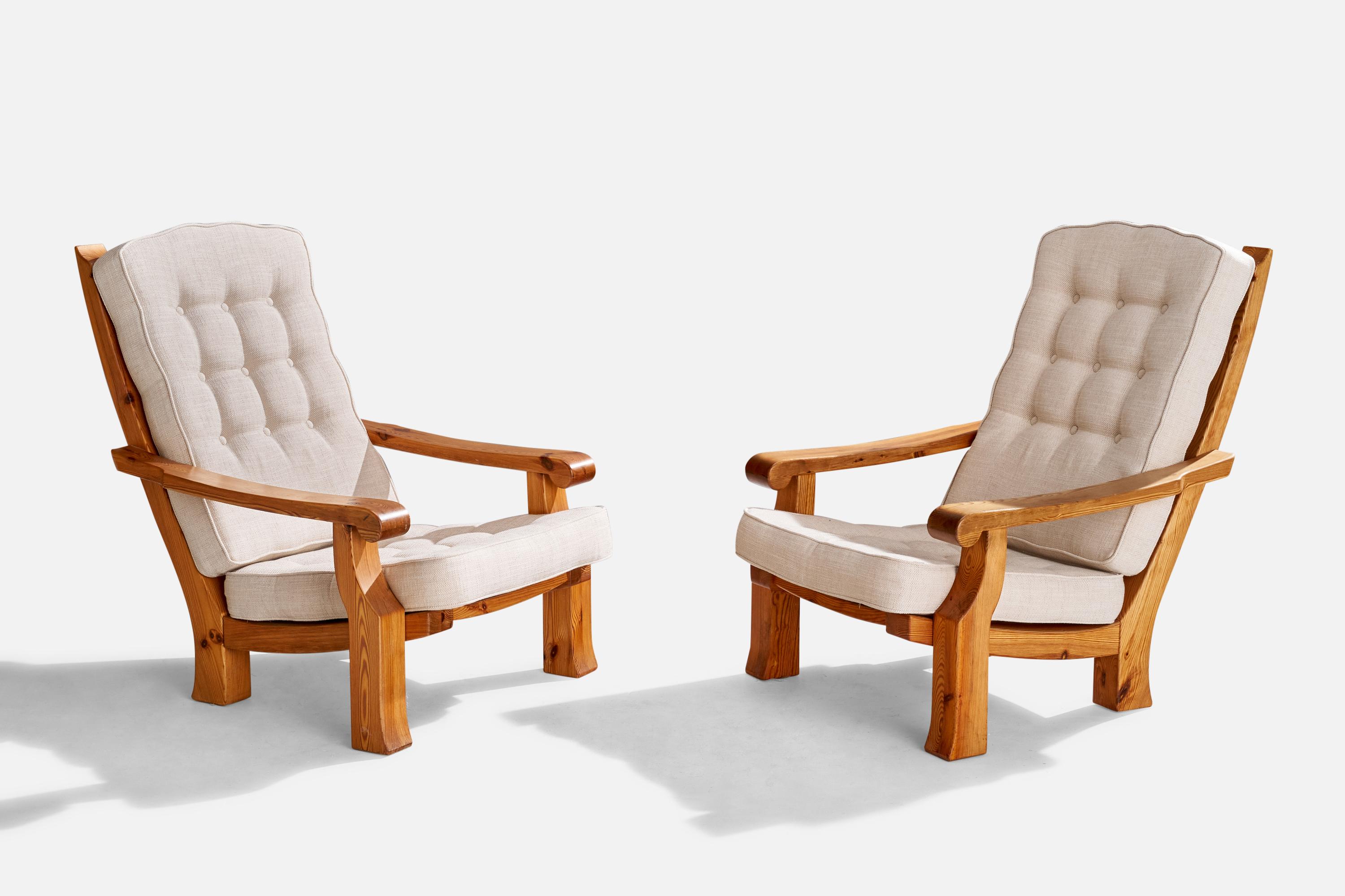 A pair of pine and white fabric lounge chairs designed and produced in Sweden, c. 1970s.

Overall Dimensions: 38.75