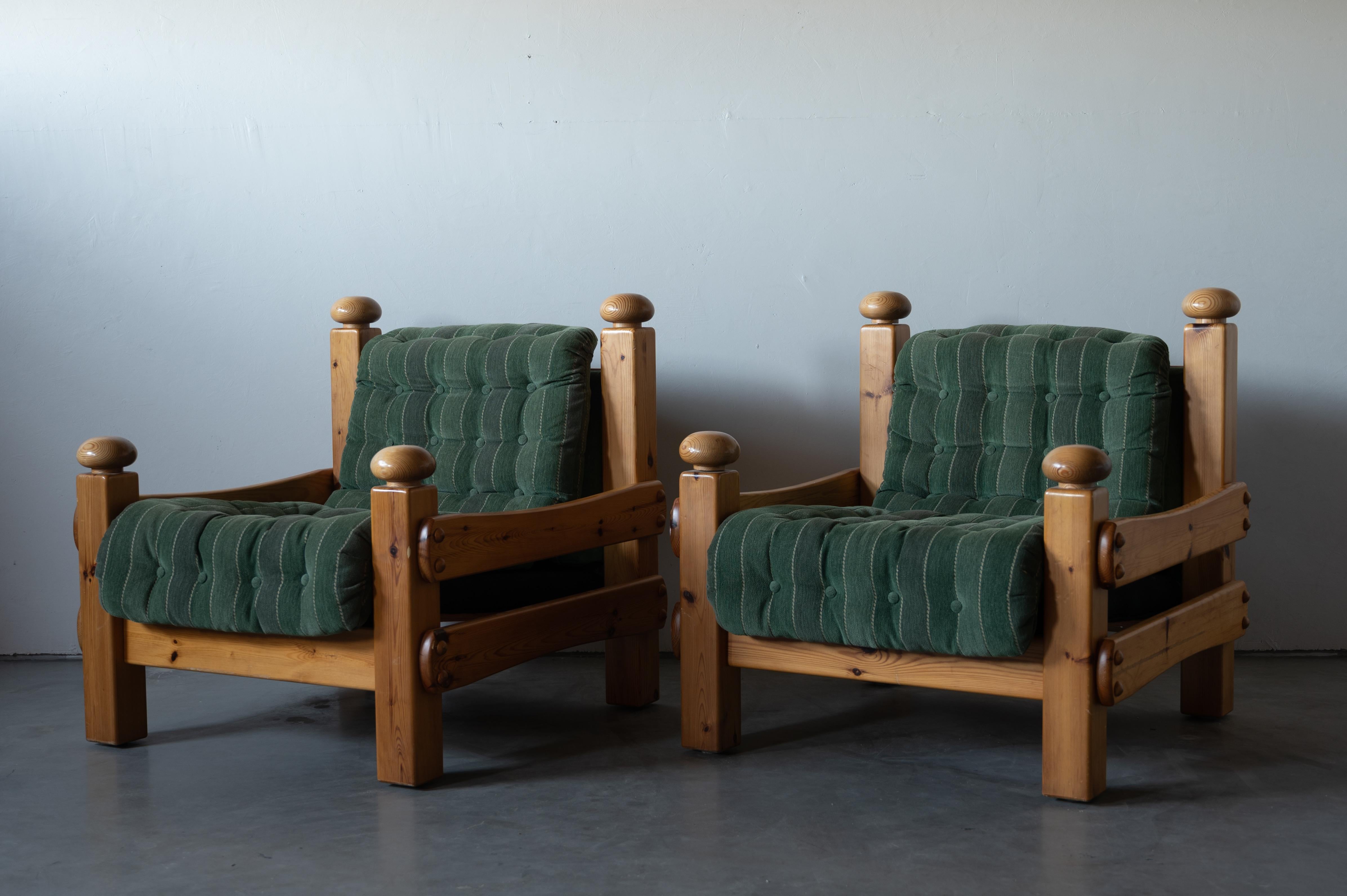 A pair of lounge chairs. Designed and produced in Sweden, 1970s. Cushions upholstered in green fabric and fitted with buttons.

Other designers of the period include Pierre Chapo, Axel Einar Hjorth, Charlotte Perriand, and George Nakashima.