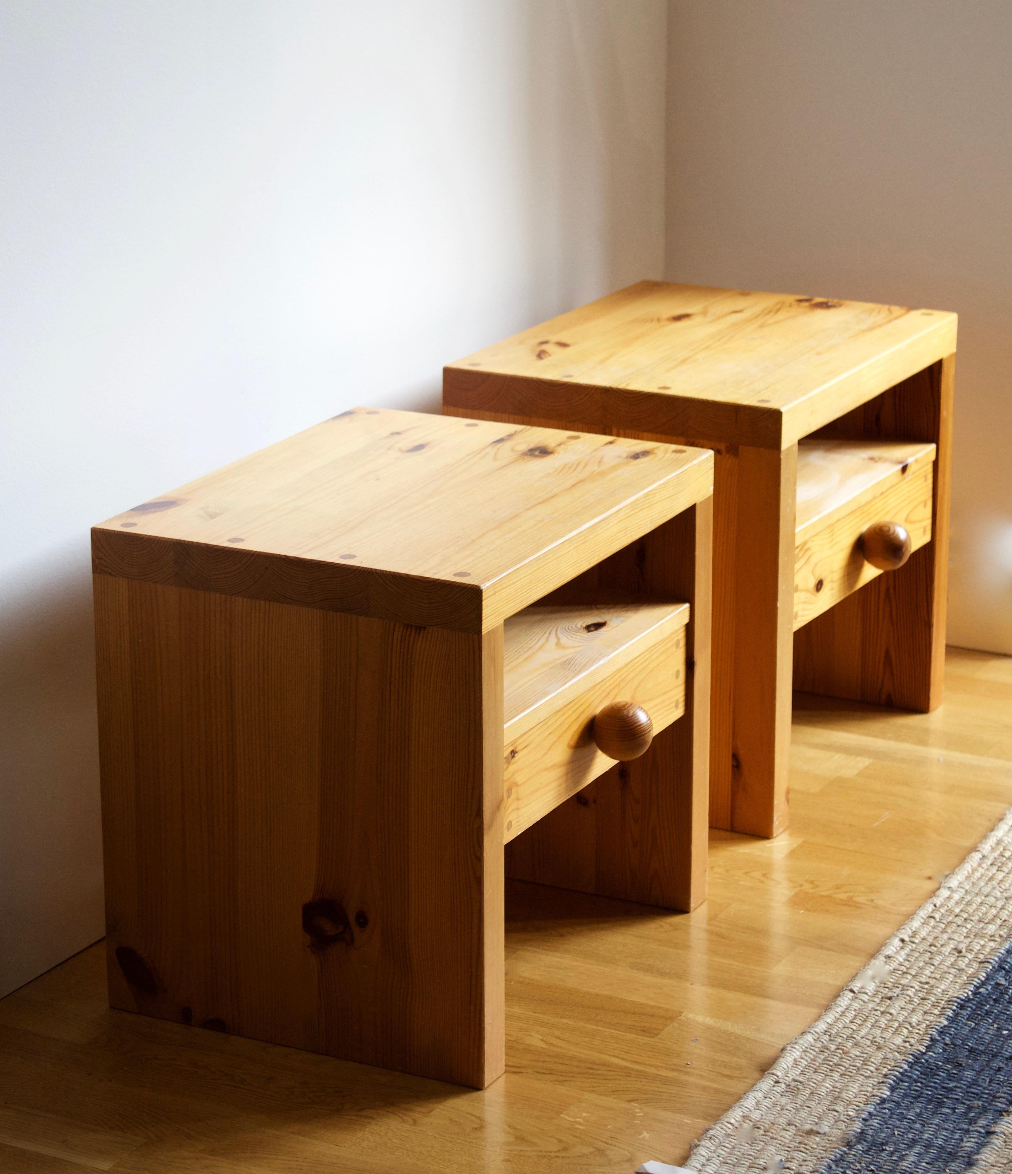 A set of bedside cabinets / tables / nightstands. Designed and produced in Sweden, 1970s. In solid pine. Features wooden joinery and drawers with finely turned round pulls.

Other designers working in similar style and materials include Axel Einar