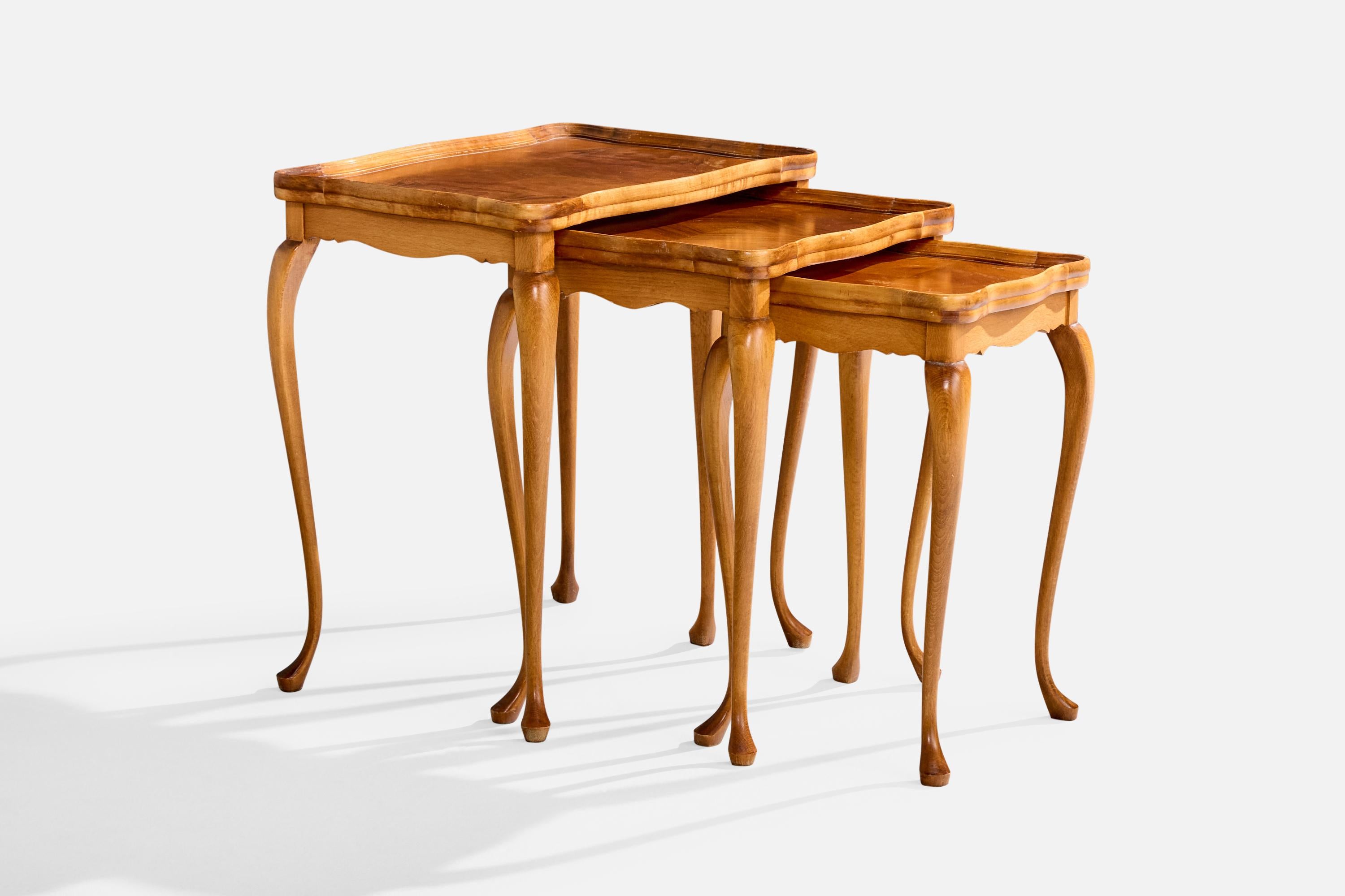 A set of three birch and walnut nesting tables designed and produced in Sweden, c. 1920s.

Largest Table Dimensions (inches): 22.125