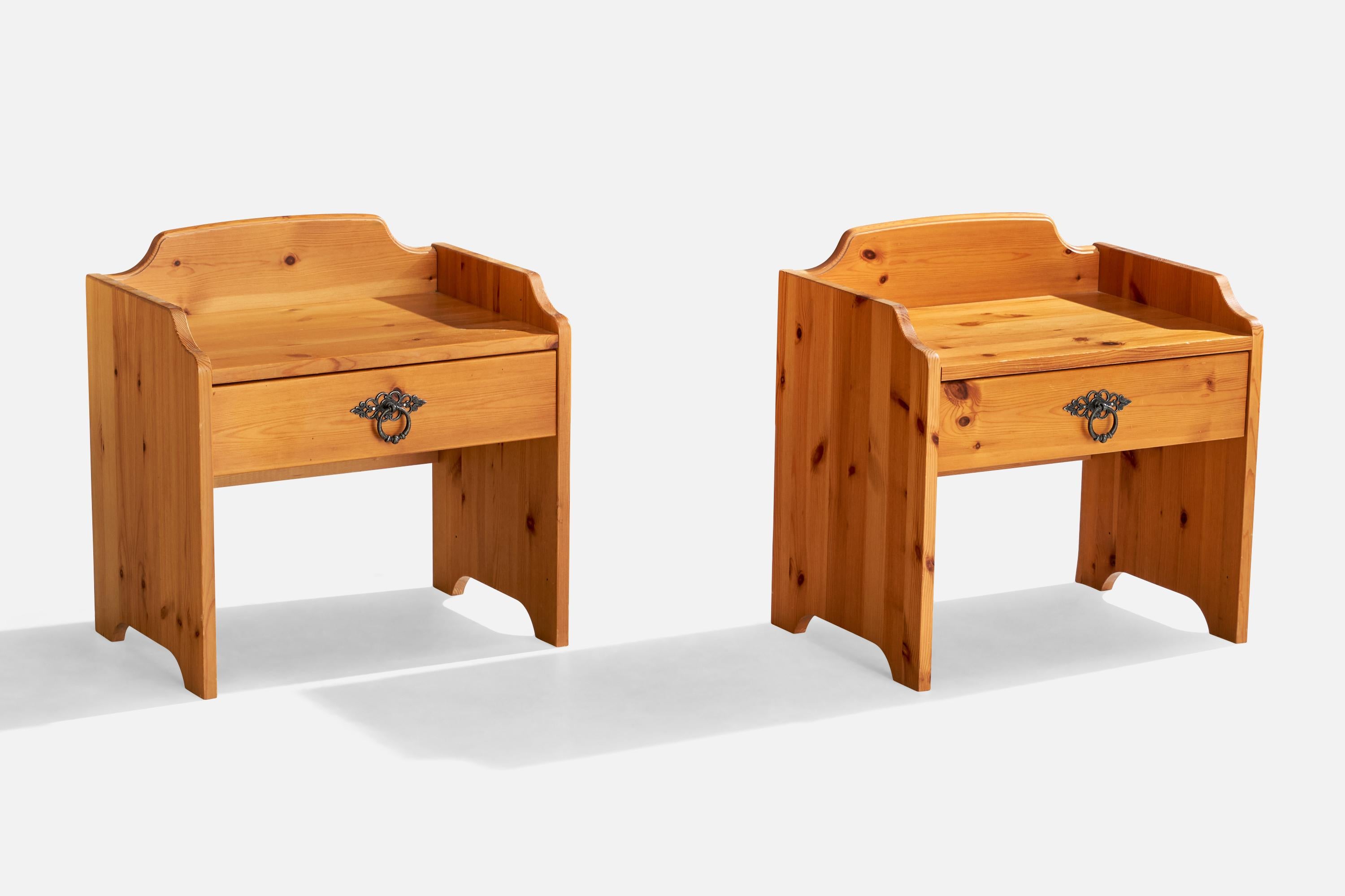 A pair of pine and iron nightstands designed and produced in Sweden, c. 1980s.

Dimensions: 20.5” H x 20” W x 14” D
