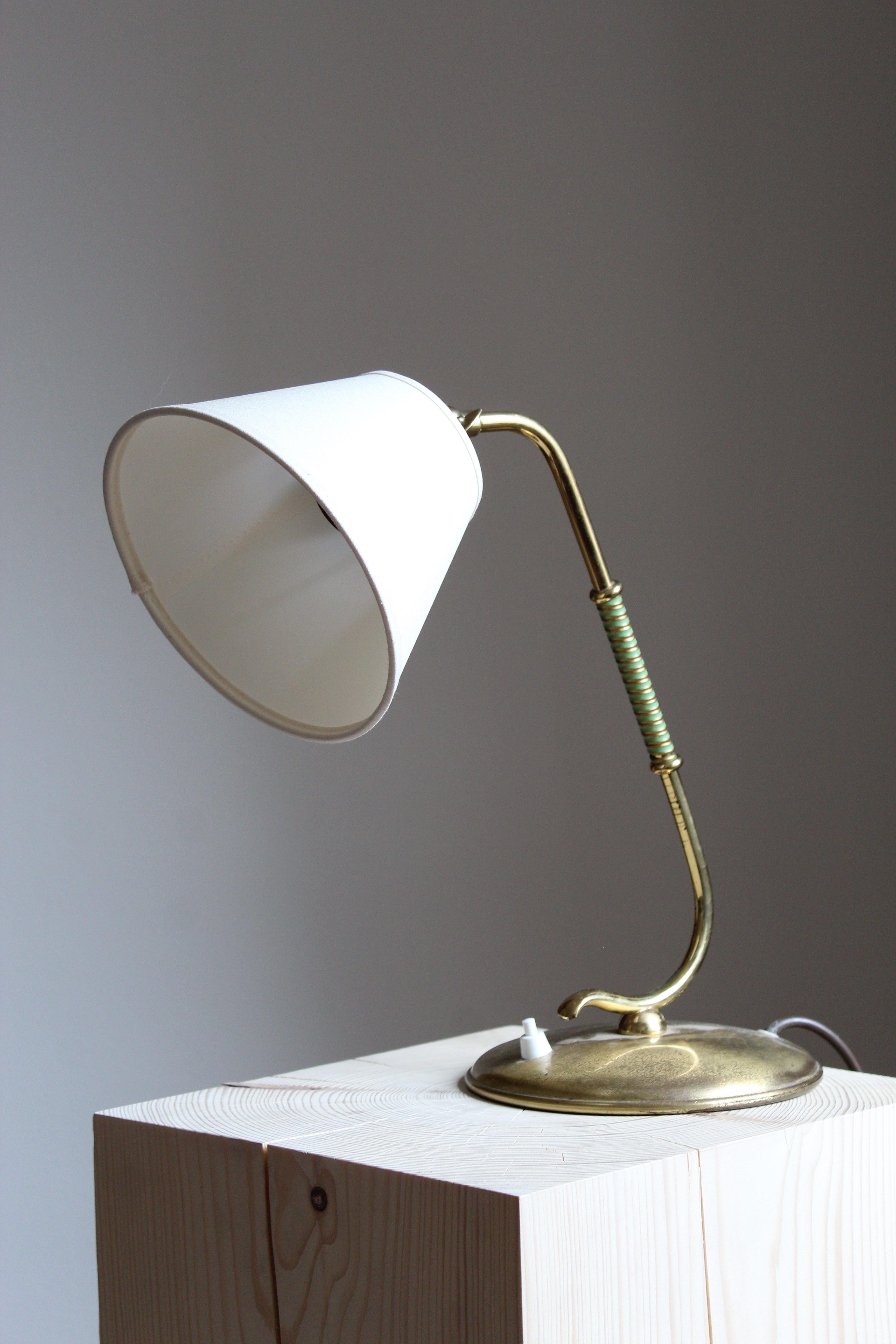 A table lamp or desk light. In brass. Brand new fabric lampshade. Green lacquered details on rod. Produced by 
Valinte Oy.

Other designers of the period include Josef Frank, Paavo Tynell, Hans Bergström, Böhlmarks, and Jean Royère.