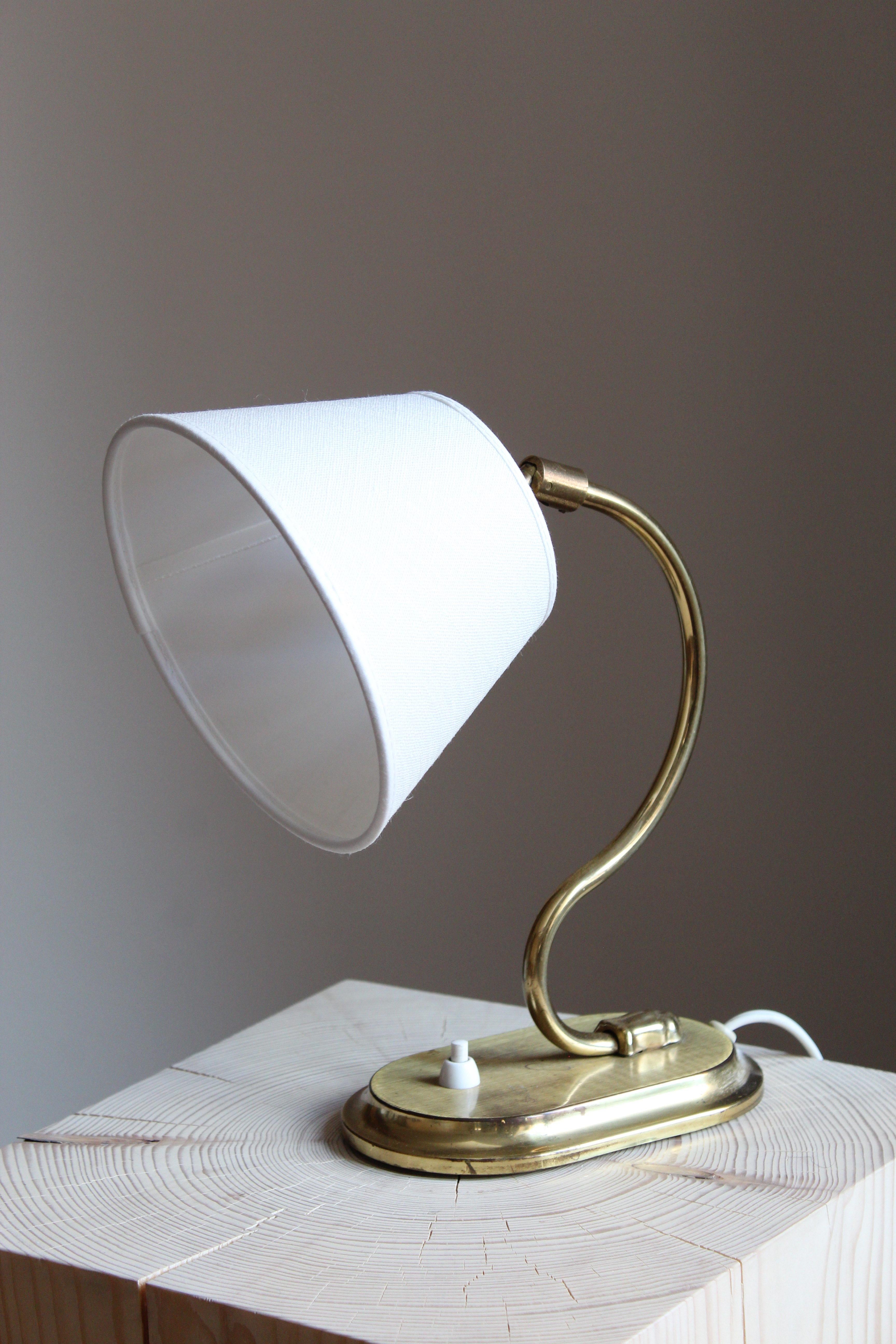 A table lamp or desk light. In brass. Brand new linen lampshade.

Other Designers of the period include Josef Frank, Paavo Tynell, Hans Bergström, Böhlmarks, and Jean Royère.