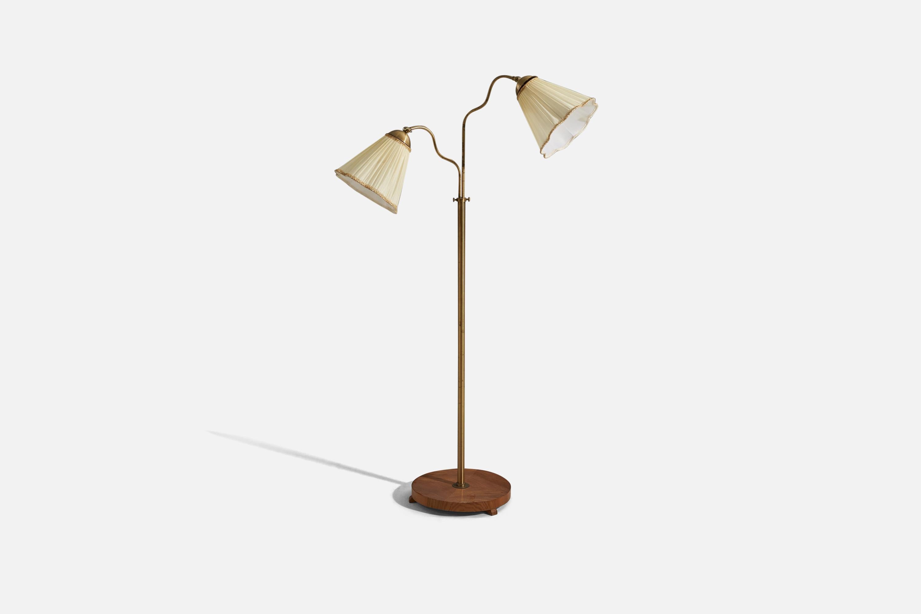 A brass, wood and white fabric wall lamp designed and produced in Sweden, c. 1940s. 

Sold with Lampshade(s). 
Stated dimensions refer to the Floor Lamp with the Shade(s). 
Variable dimensions, measured as illustrated in the first image.

Socket